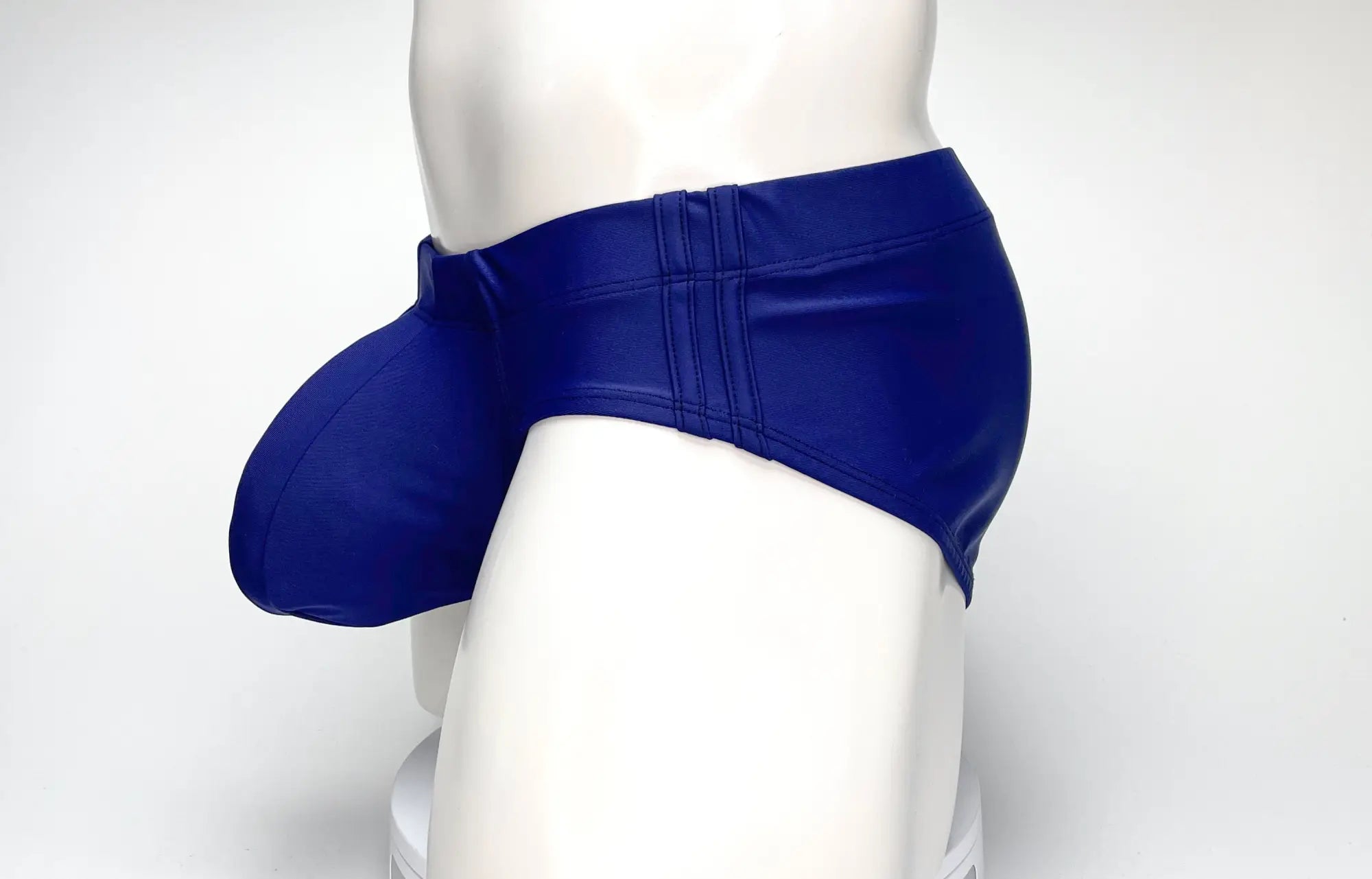 Blue faux leather WildmanT big boy pouch swim brief with prominent padded pouch in navy for swimwear use