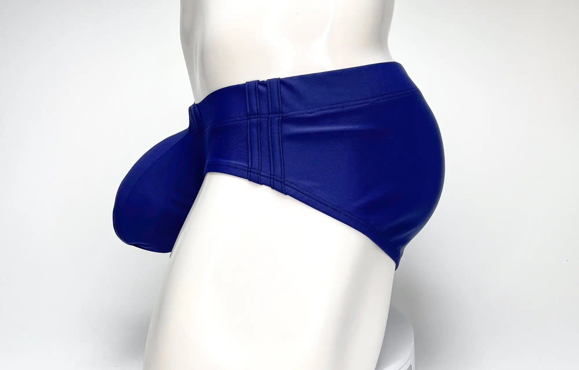 Royal blue faux leather swim briefs by WildmanT featuring a prominent big boy pouch design in navy color