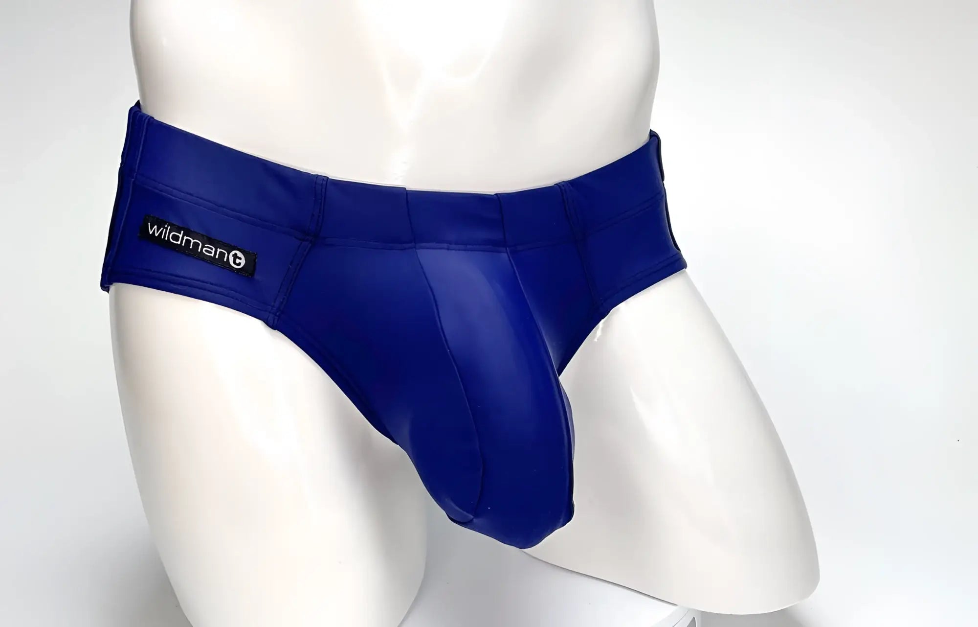 Royal blue glossy faux leather WildmanT big boy pouch swim briefs with black wildman brand label on waistband