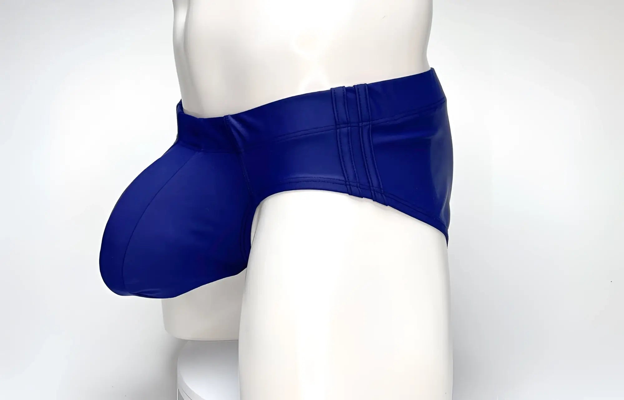 Wildmant big boy pouch swim brief navy in vibrant royal blue glossy latex with sleek form-fitting design