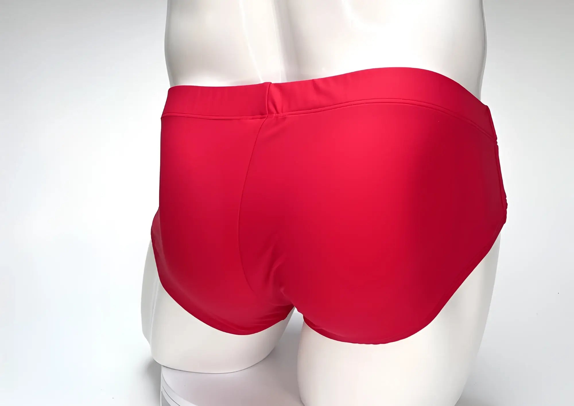 Bright red WildmanT big boy pouch swim brief with smooth glossy fabric finish for swimming and beachwear