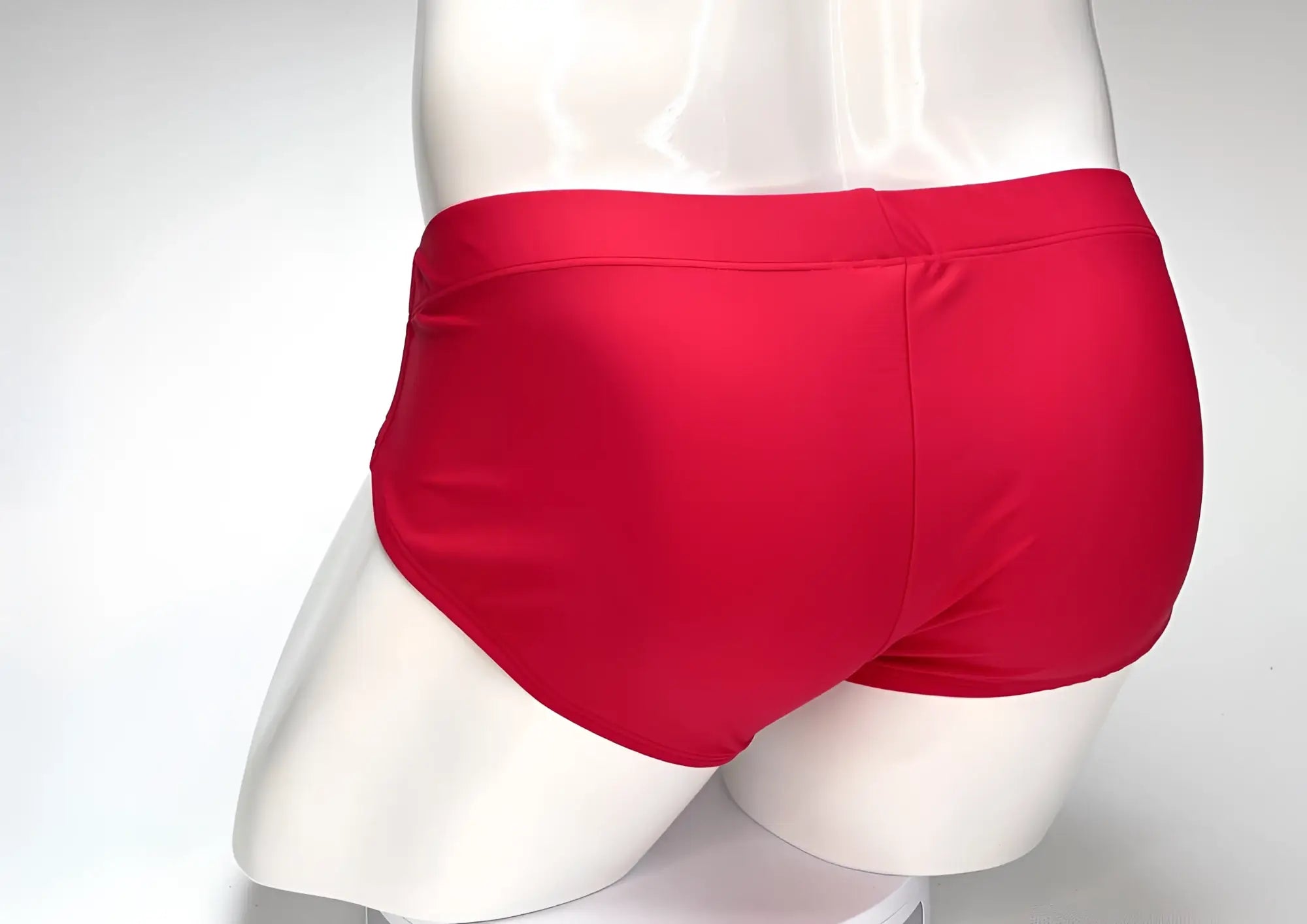 WildmanT big boy pouch swim brief in bright red satin fabric with a smooth, snug-fitting design