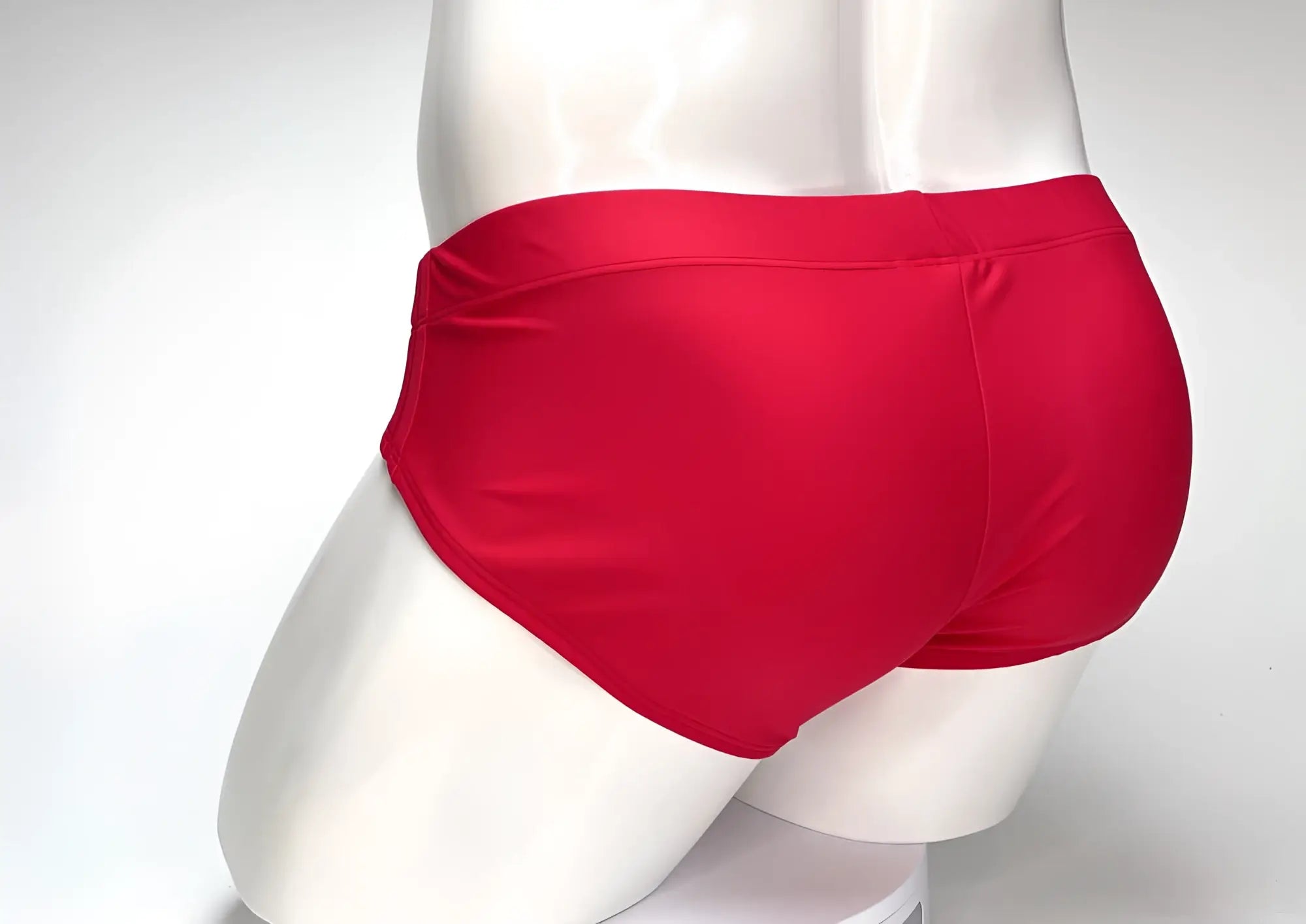 Wildmant big boy pouch swim brief red in bright red satin fabric with a snug fit for comfortable swimwear use