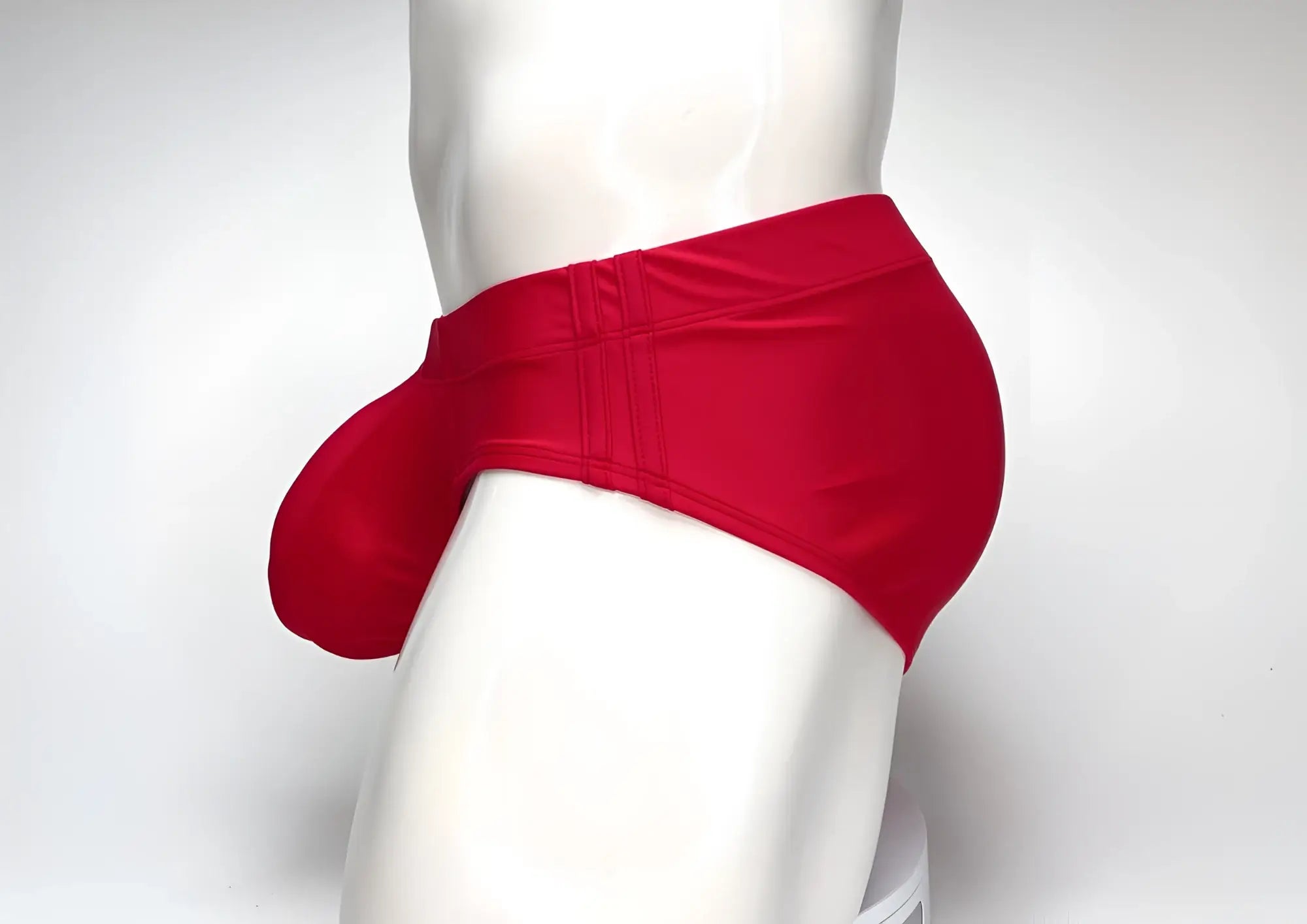 Wildmant big boy pouch swim brief in red features a glossy smooth fabric with a distinctive pouch design