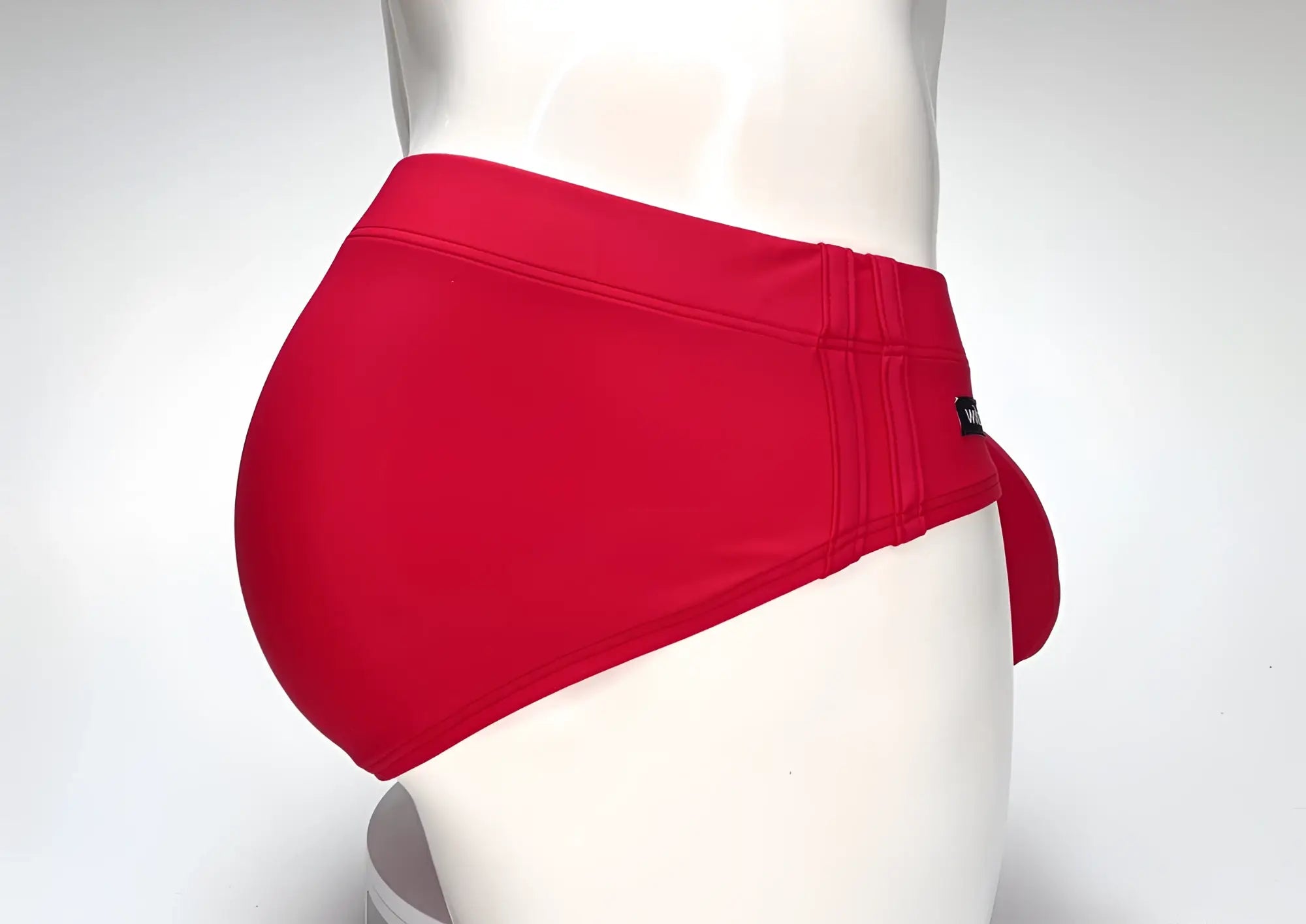 Wildmant big boy pouch swim brief in vibrant red with sleek form-fitting design and subtle stitching details