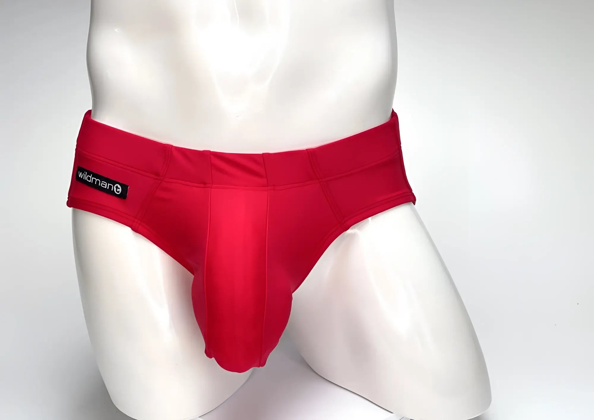 Red wildman swim trunks with smooth form-fitting fabric and prominent central pouch design wildmanT big boy pouch brief