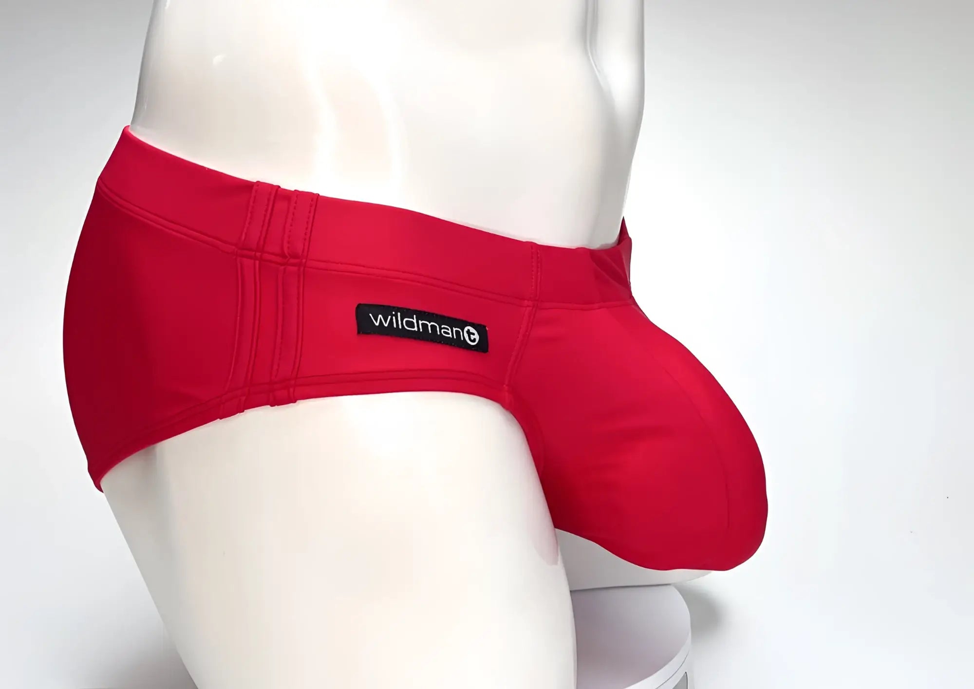 Red wildman brand snug form-fitting big boy pouch swim brief in bright red for swimming and beachwear use