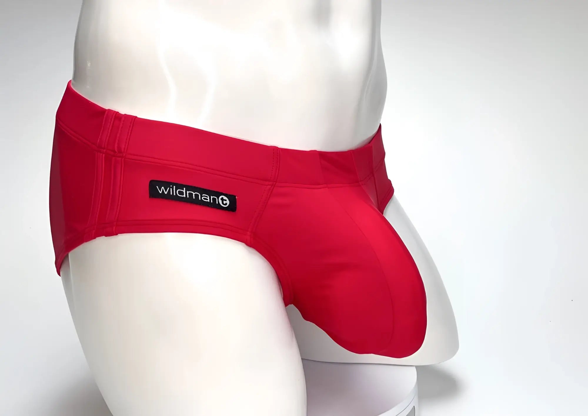 Red wildman swim trunks with snug form-fitting design in bright red for active beach and pool use