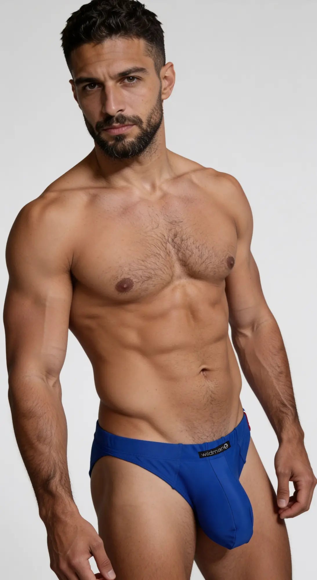 Wildmant big boy pouch swim brief thong in royal blue with black logo waistband designed for men