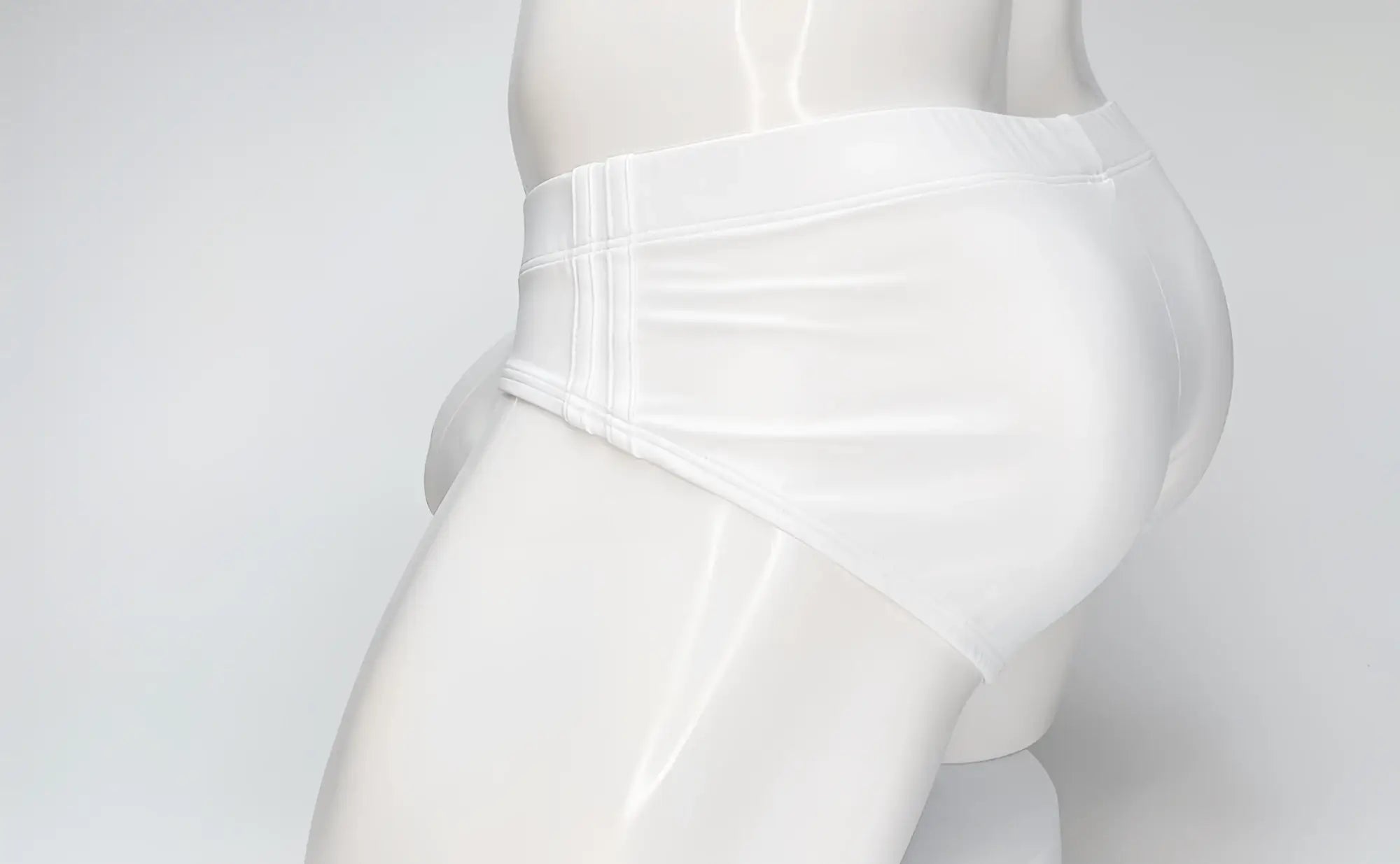 Wildmant big boy pouch swim brief in white glossy fabric with a smooth form-fitting design for swimming use