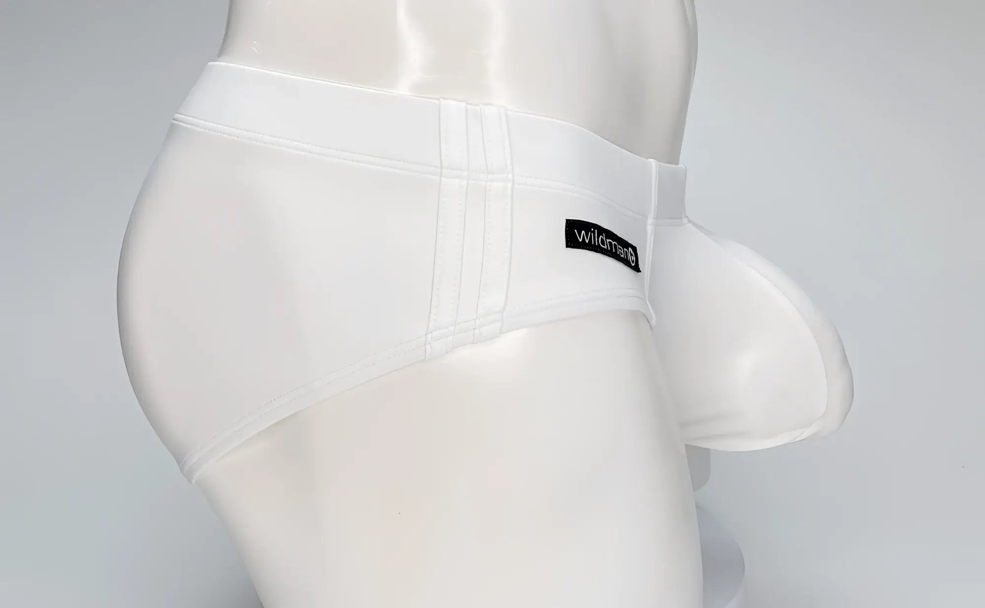 White mens briefs with molded pouch support and black wildman label on waistband from wildmant big boy pouch swim brief white