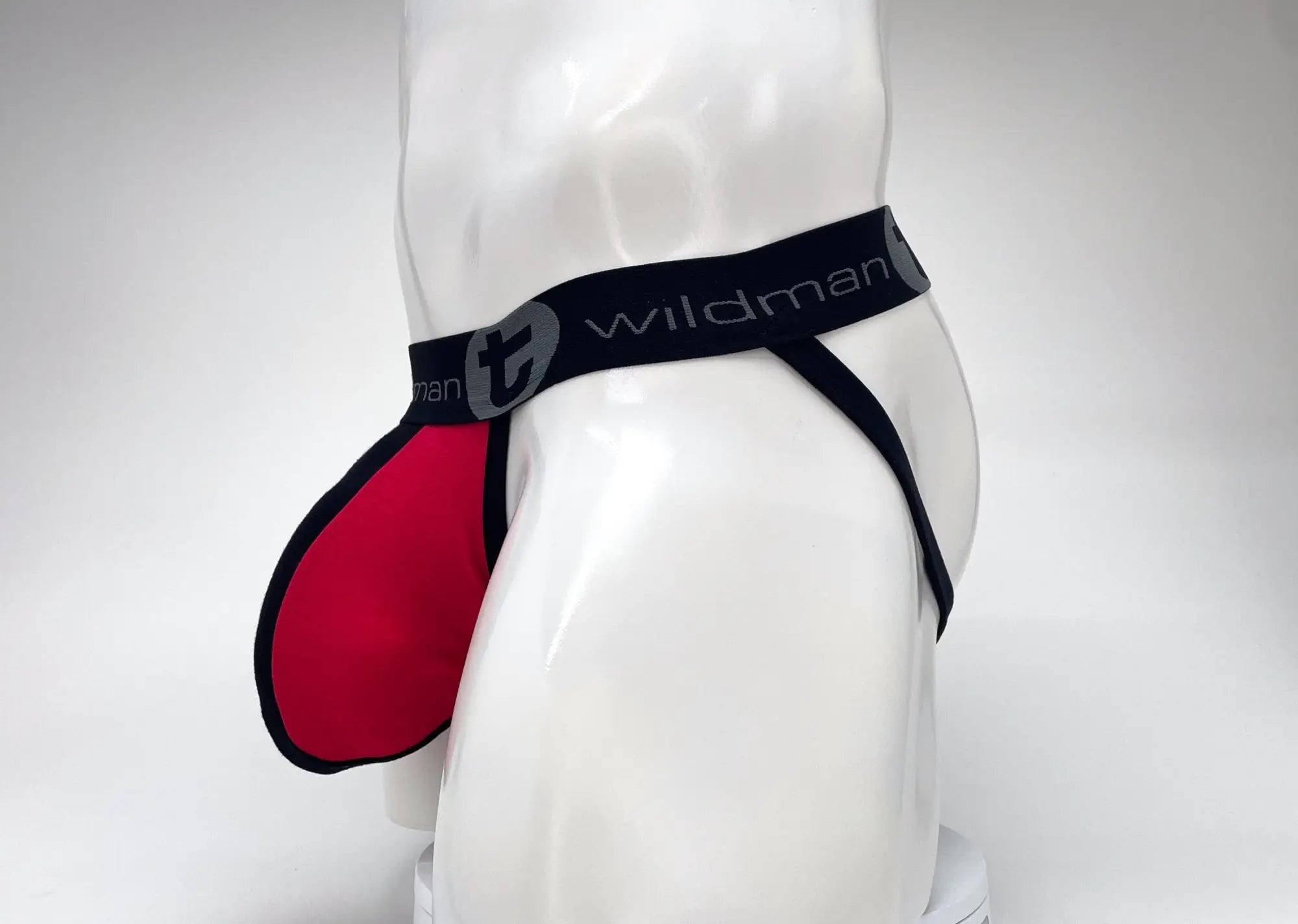 Wildman brand men’s cotton big boy pouch stripe jockstrap in red and black with a bold contrasting color scheme