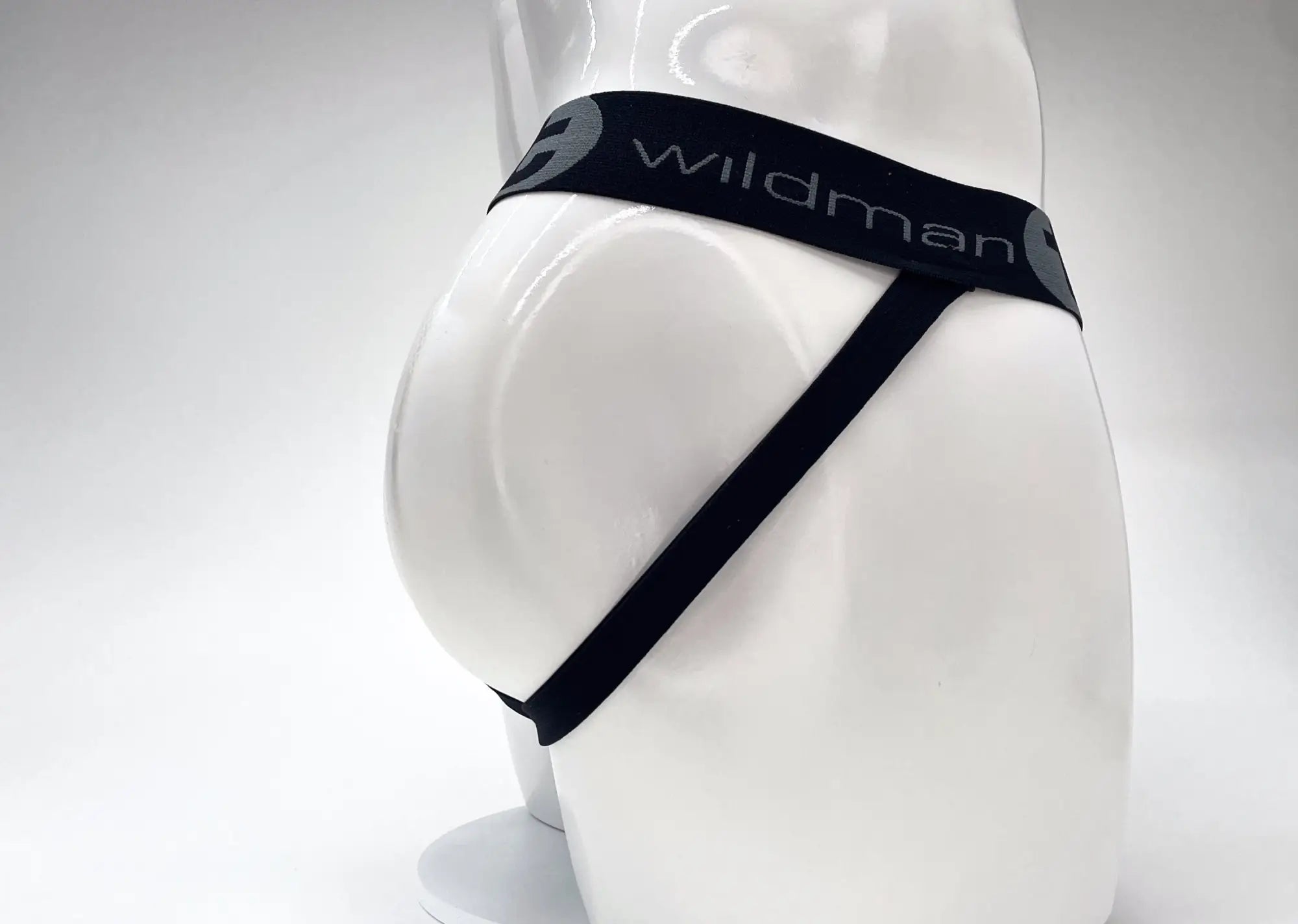 WildmanT cotton big boy pouch stripe jockstrap in red and black with a sleek elastic waistband and diagonal straps