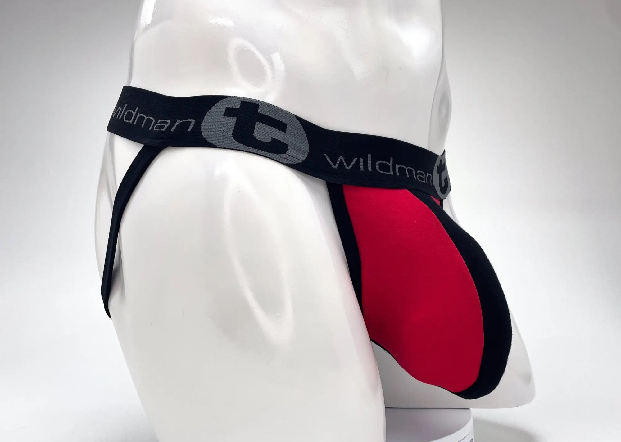 Wildmant cotton big boy pouch stripe jockstrap in red and black with gray logo on waistband front view
