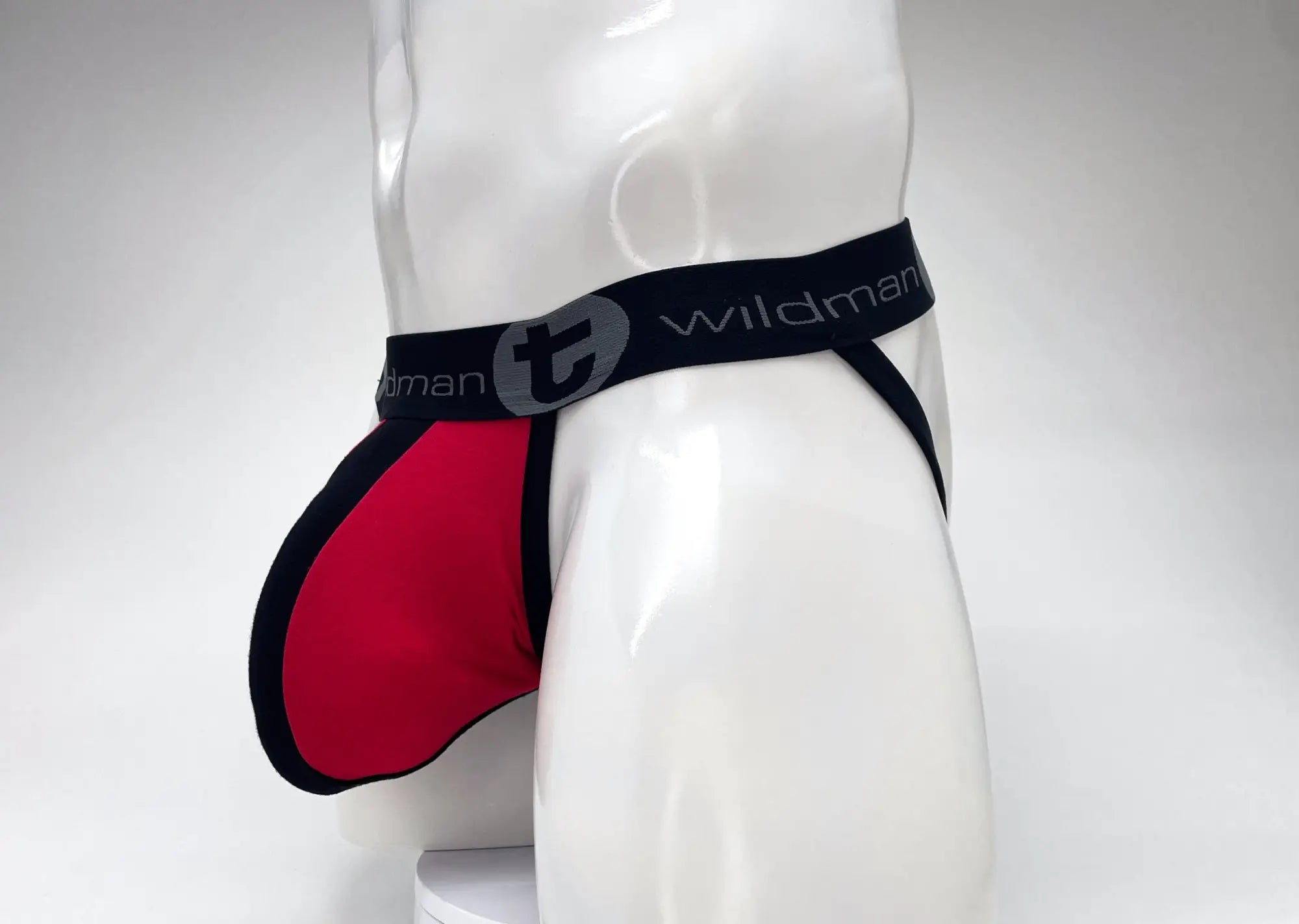 Red and black wildman brand cotton jockstrap with sleek contoured big boy pouch stripe design