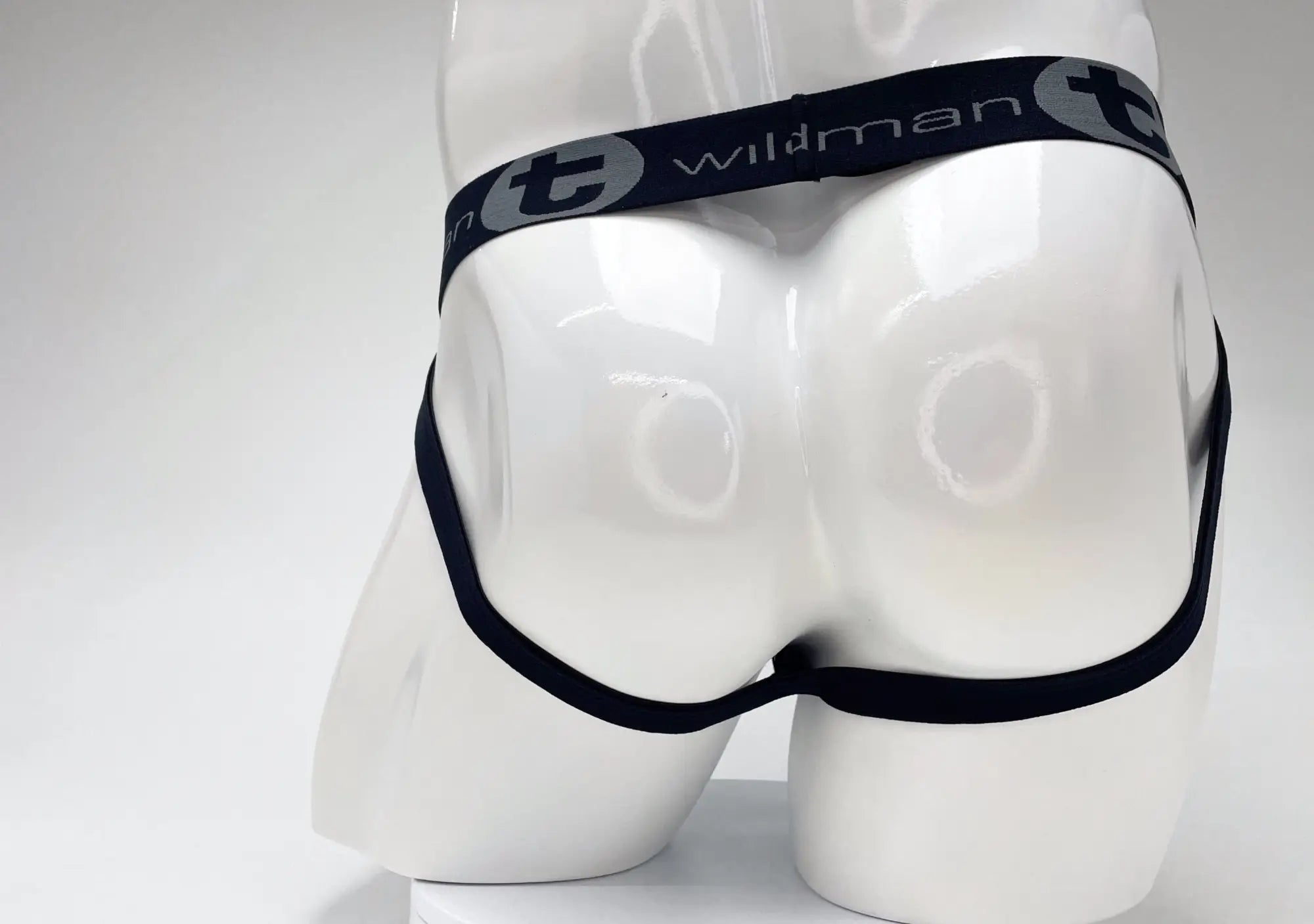 Black elastic waistband with wildman branding on white mannequin for wildmant cotton big boy pouch royal blue jockstrap