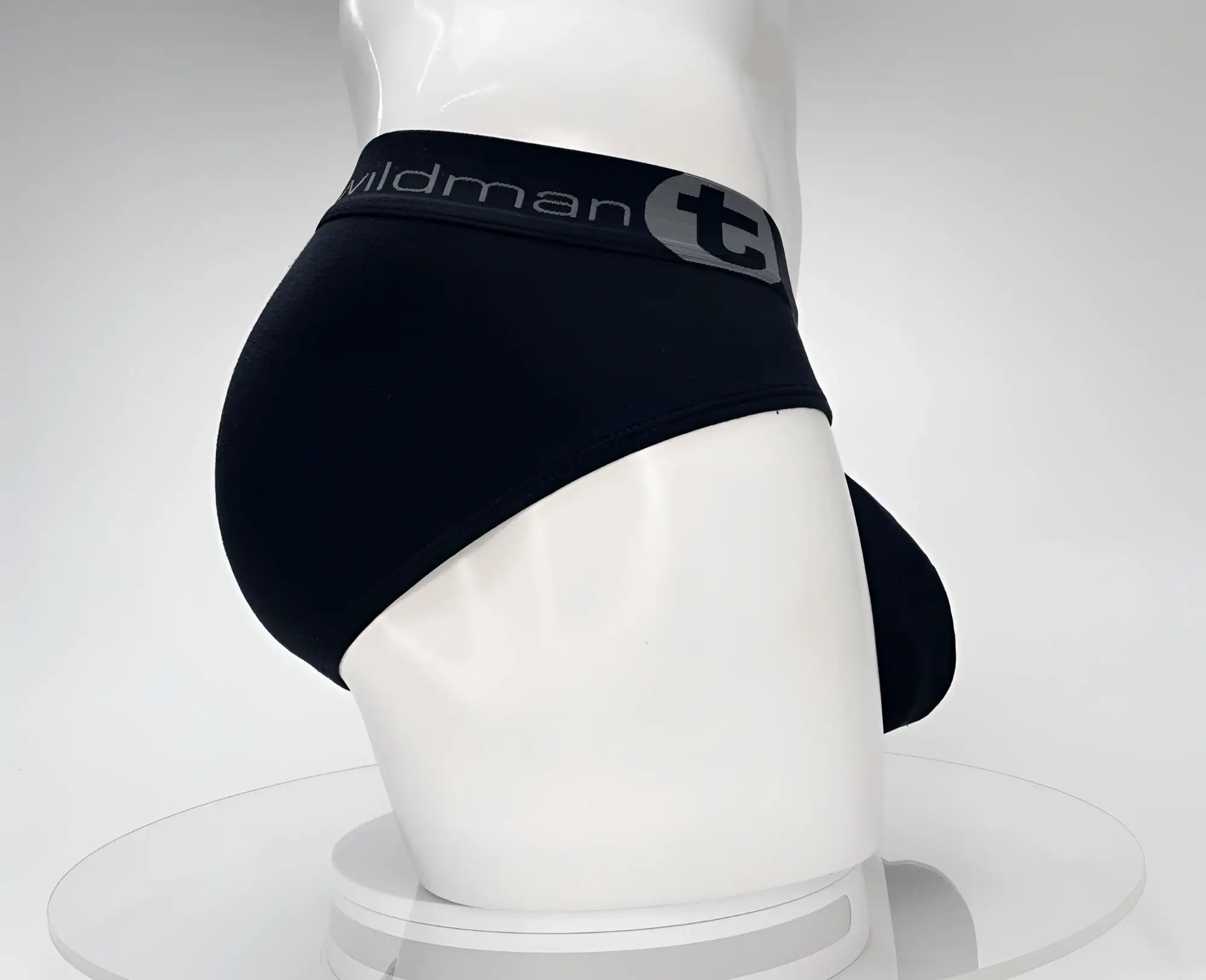 Black cotton WildmanT monster cock brief with gray elastic waistband featuring wildman logo and stylized t emblem