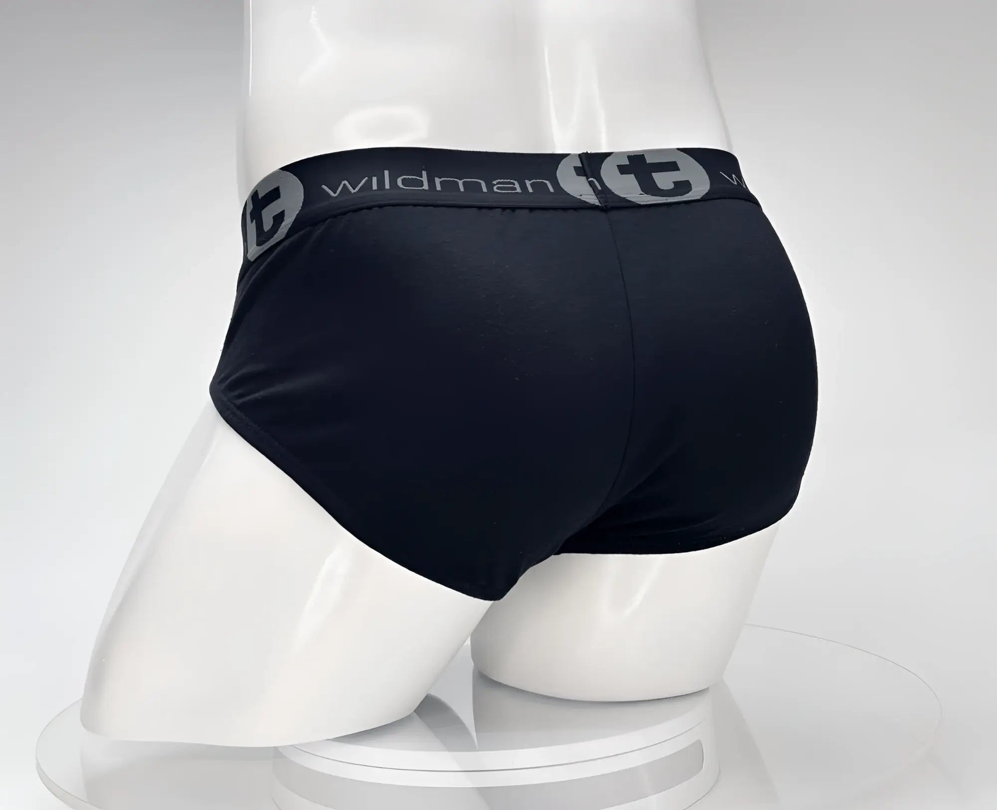 Black wildman briefs with gray elastic waistband featuring WildmanT logo made of cotton for comfortable wear