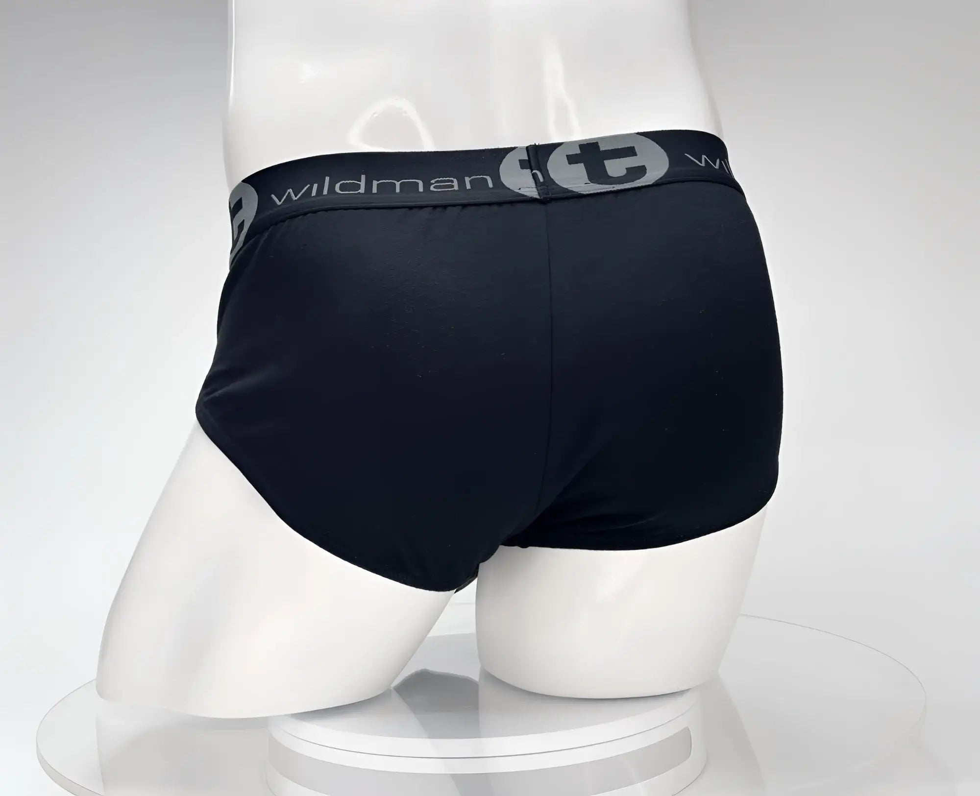 Black wildman briefs with gray elastic waistband featuring the brand logo made of cotton for comfortable wear