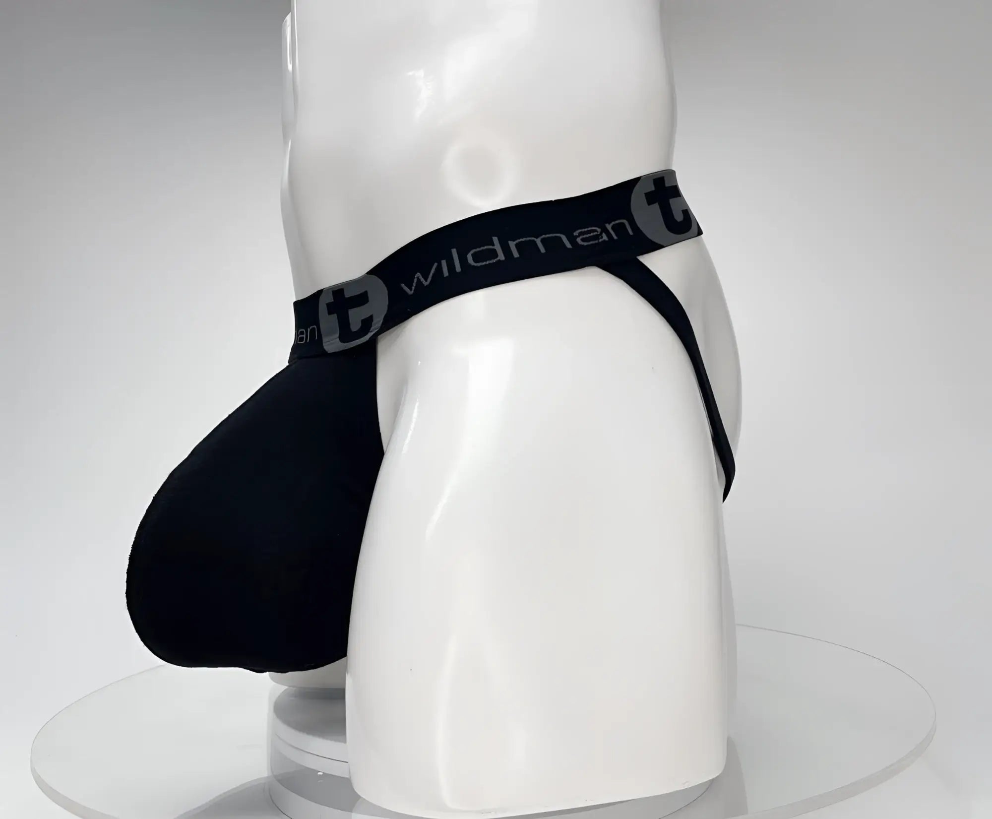 Black wildman cotton monster cock jockstrap with elastic waistband and supportive cup design visible from the front