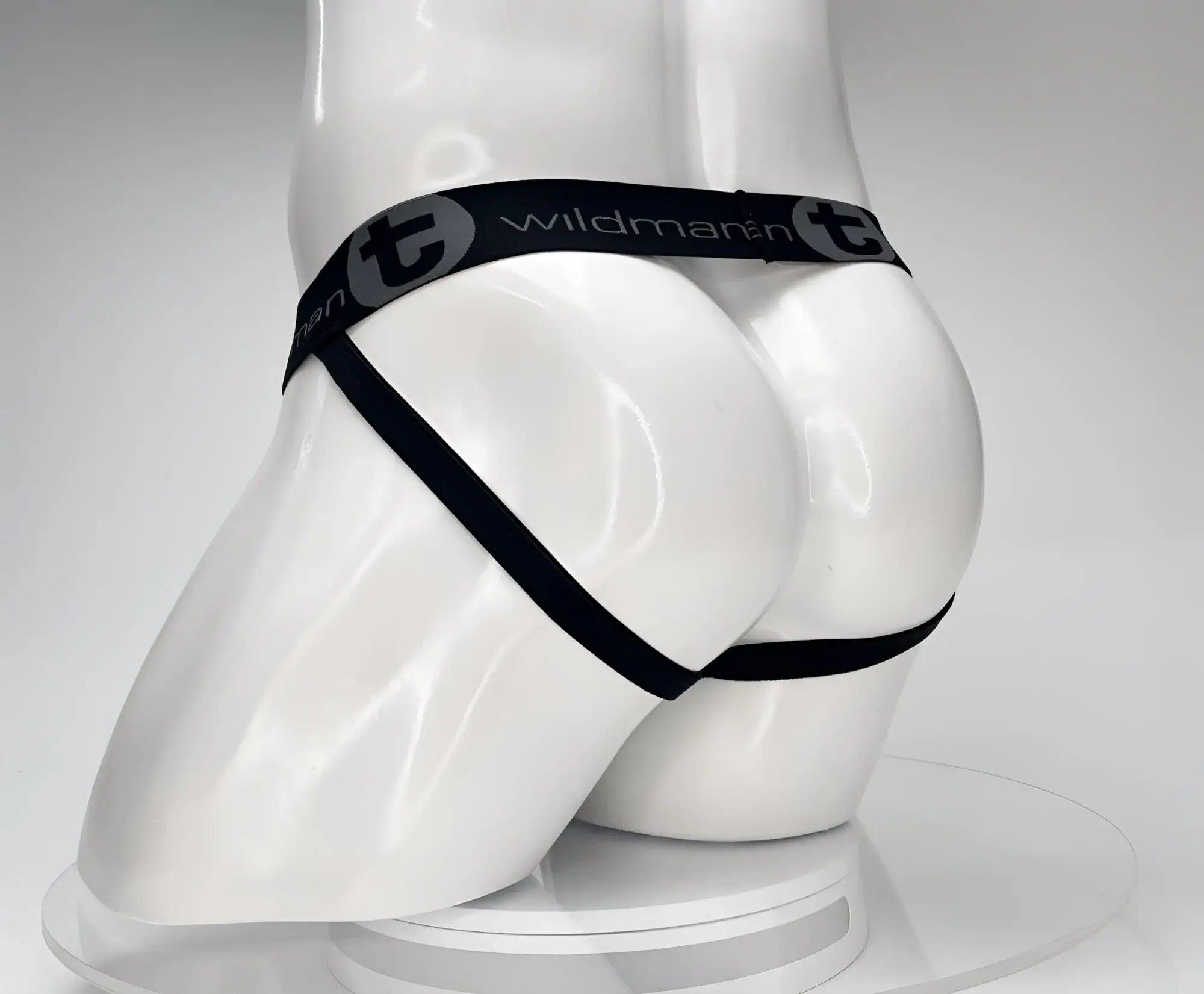 Black wildmanT cotton monster cock jockstrap thong with elastic waistband and side straps showing front view