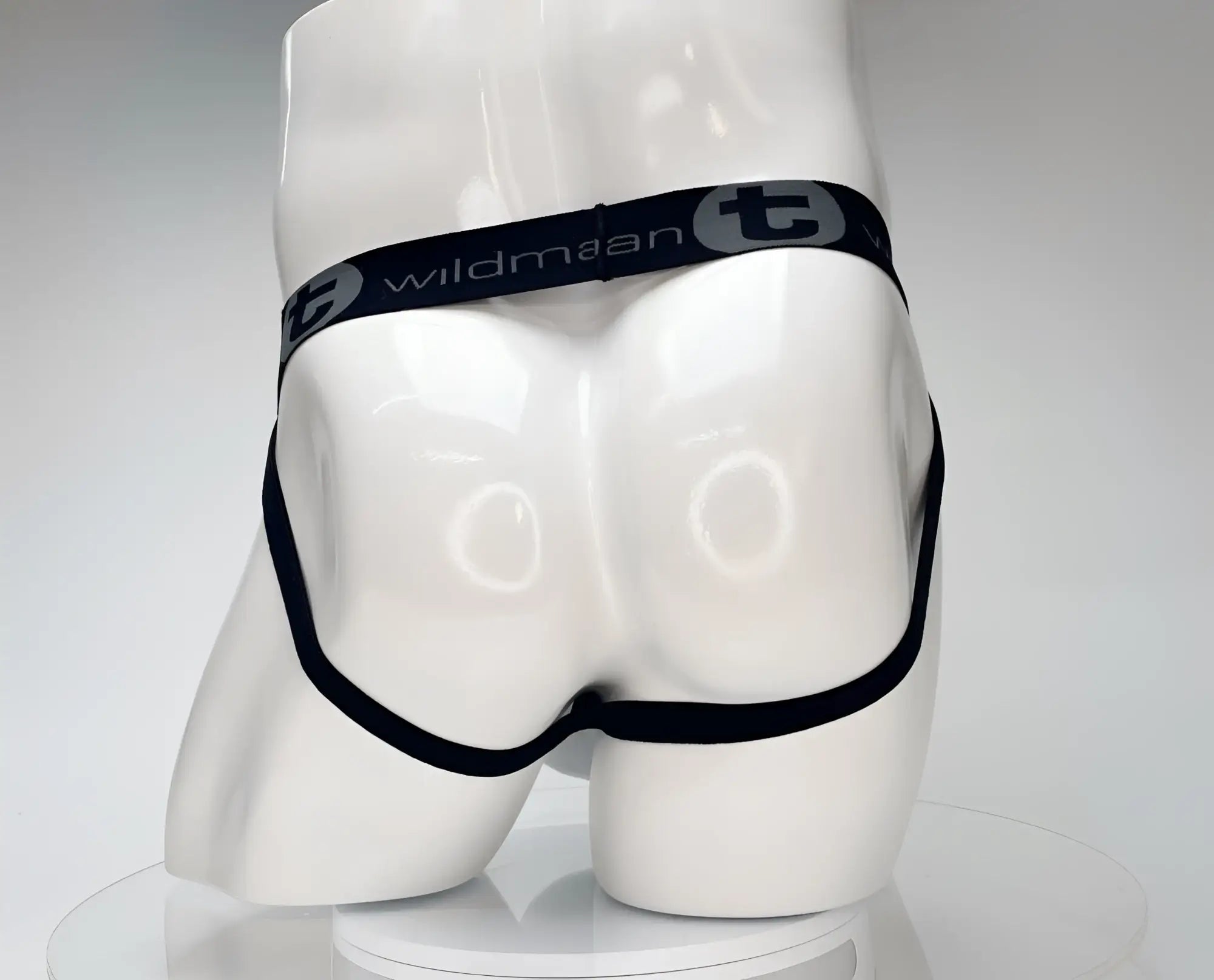 Wildmant cotton monster cock jockstrap in white with black elastic waistband briefs featuring wildman branding on front