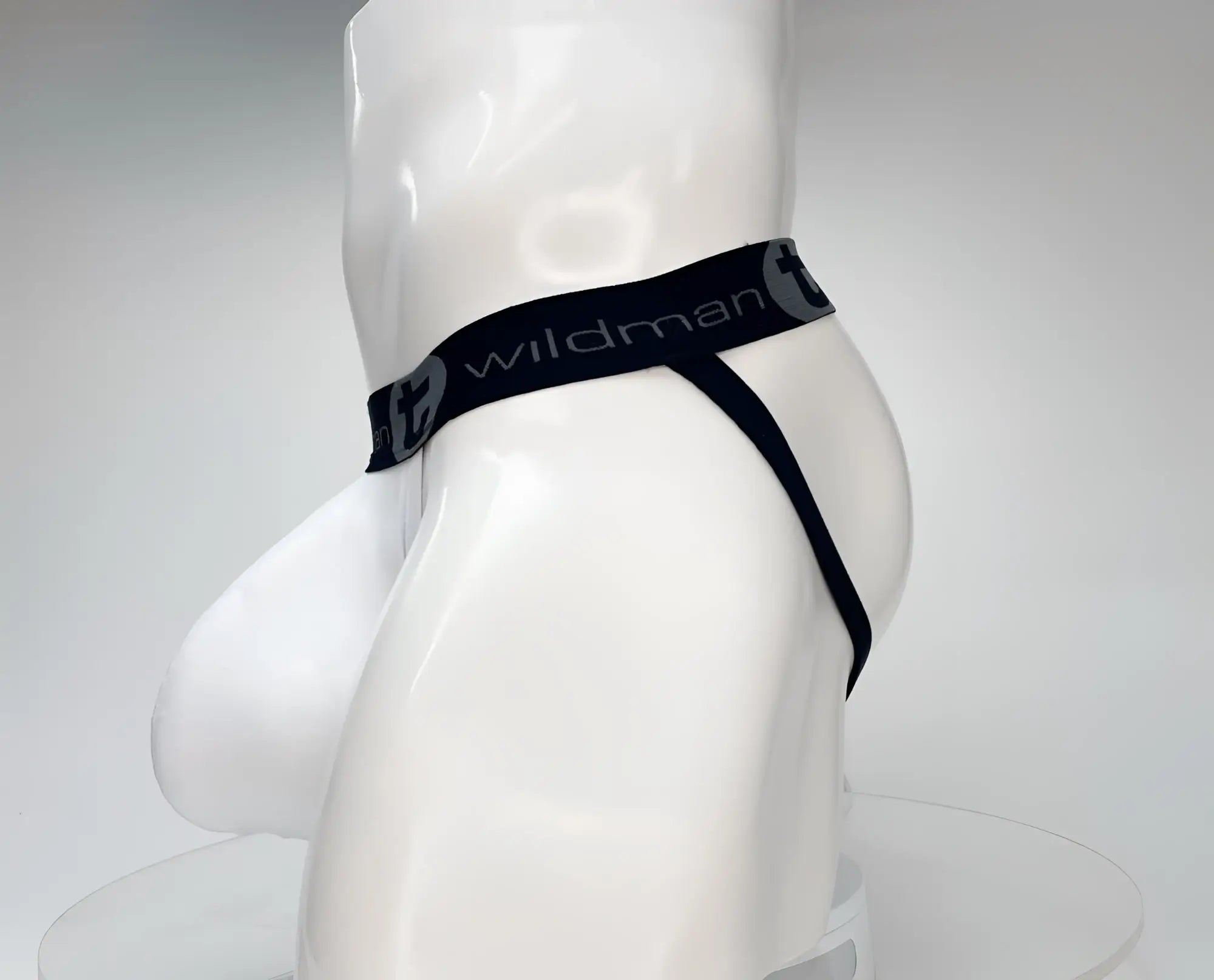 Wildman black cotton briefs with smooth elastic waistband and thin side straps from the cotton monster cock jockstrap white line