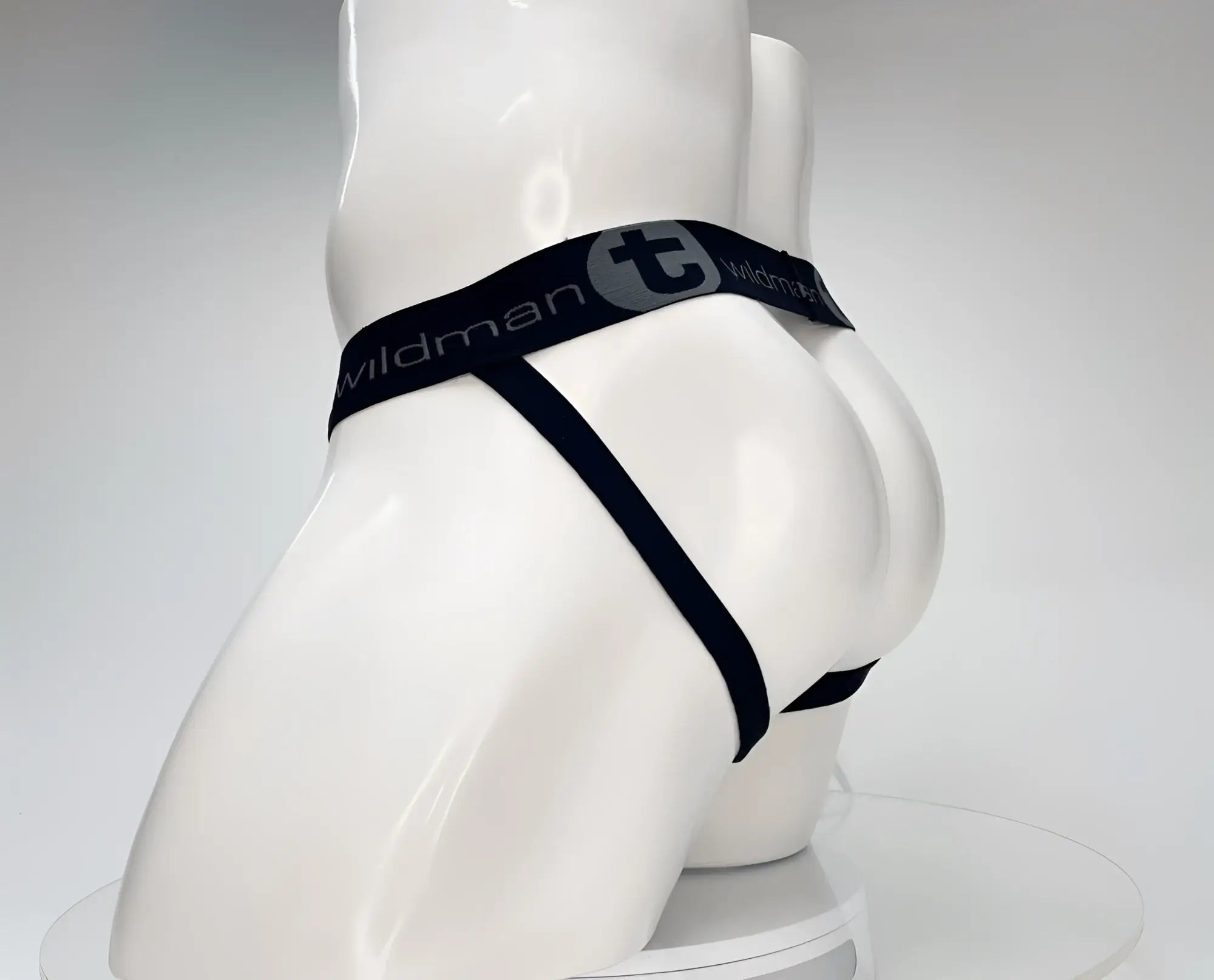 WildmanT cotton monster cock jockstrap white with sleek black wildman brand thong and elastic waistband visible from back