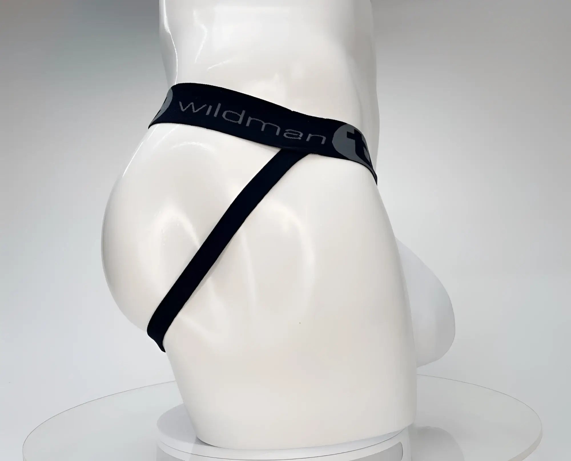 WildmanT cotton monster cock jockstrap in white featuring a sleek black wildman brand thong with elastic waistband