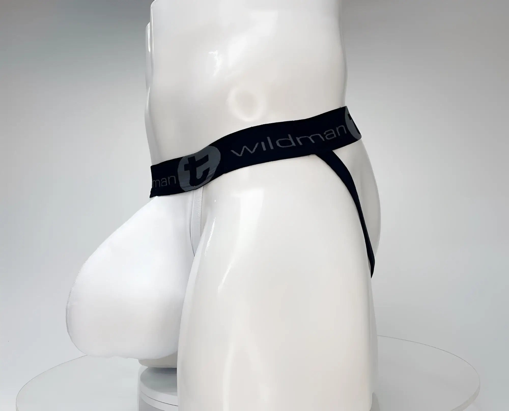 White men’s cotton briefs with black elastic waistband and gray wildman logo from wildmant cotton monster cock jockstrap white
