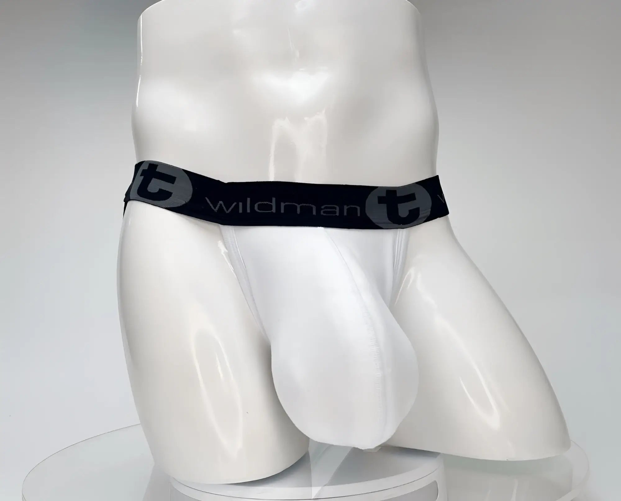 Wildmant cotton monster cock jockstrap white briefs with black elastic waistband featuring wildman logo and circular t emblem