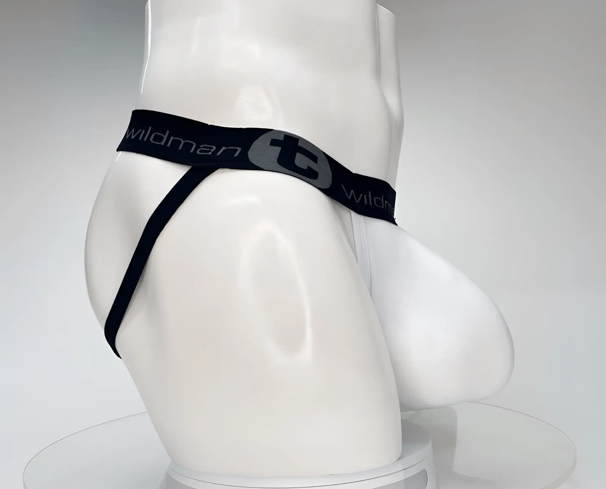 WildmanT cotton monster cock jockstrap white thong with black elastic waistband and side straps shown from back side