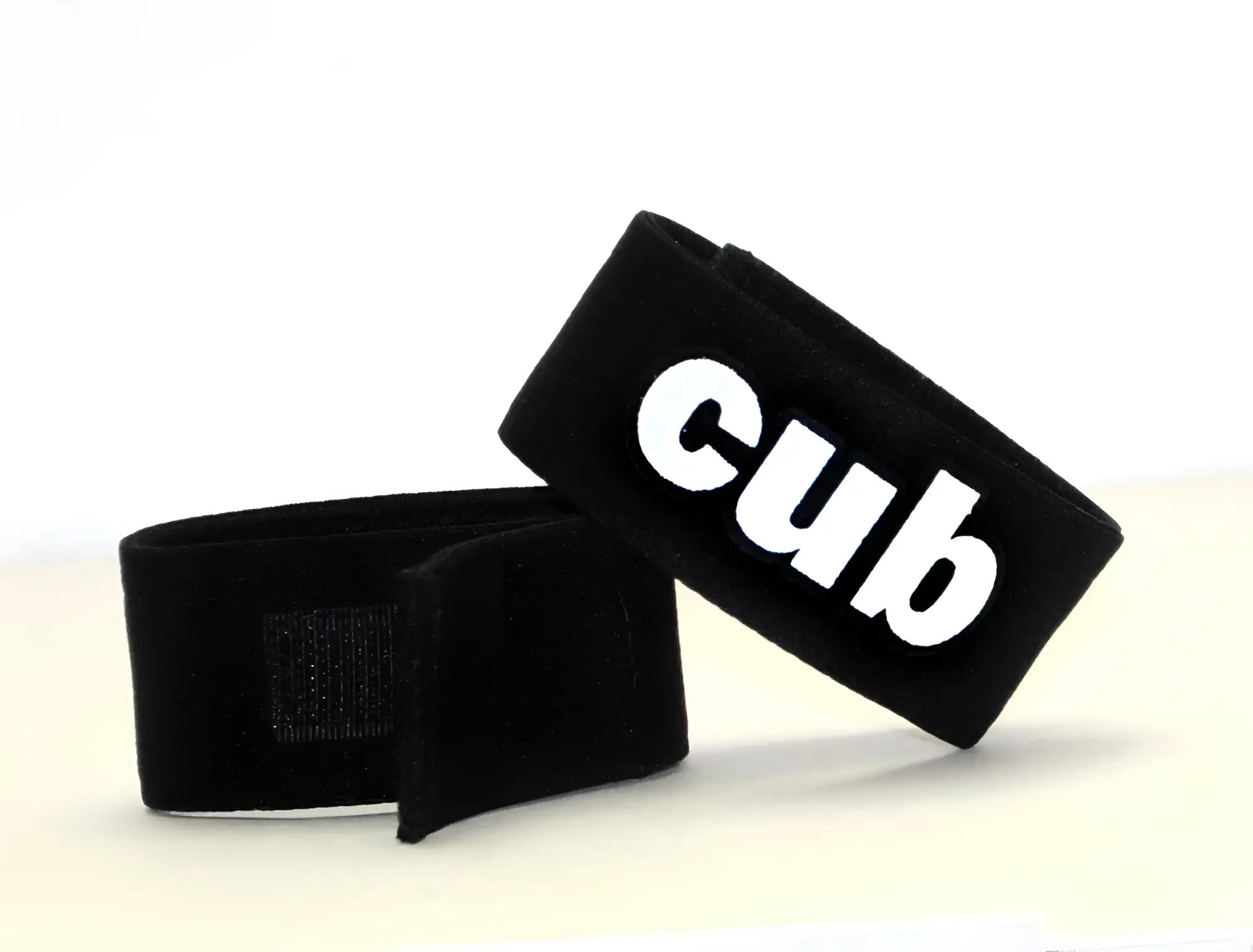 Black velour wristband with white cub logo for wildmant fetish max cock ring cub product
