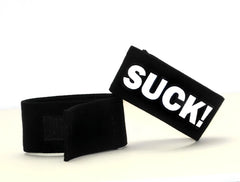 Black velour wristband with bold white suck lettering from wildmant fetish max cock ring suck product line