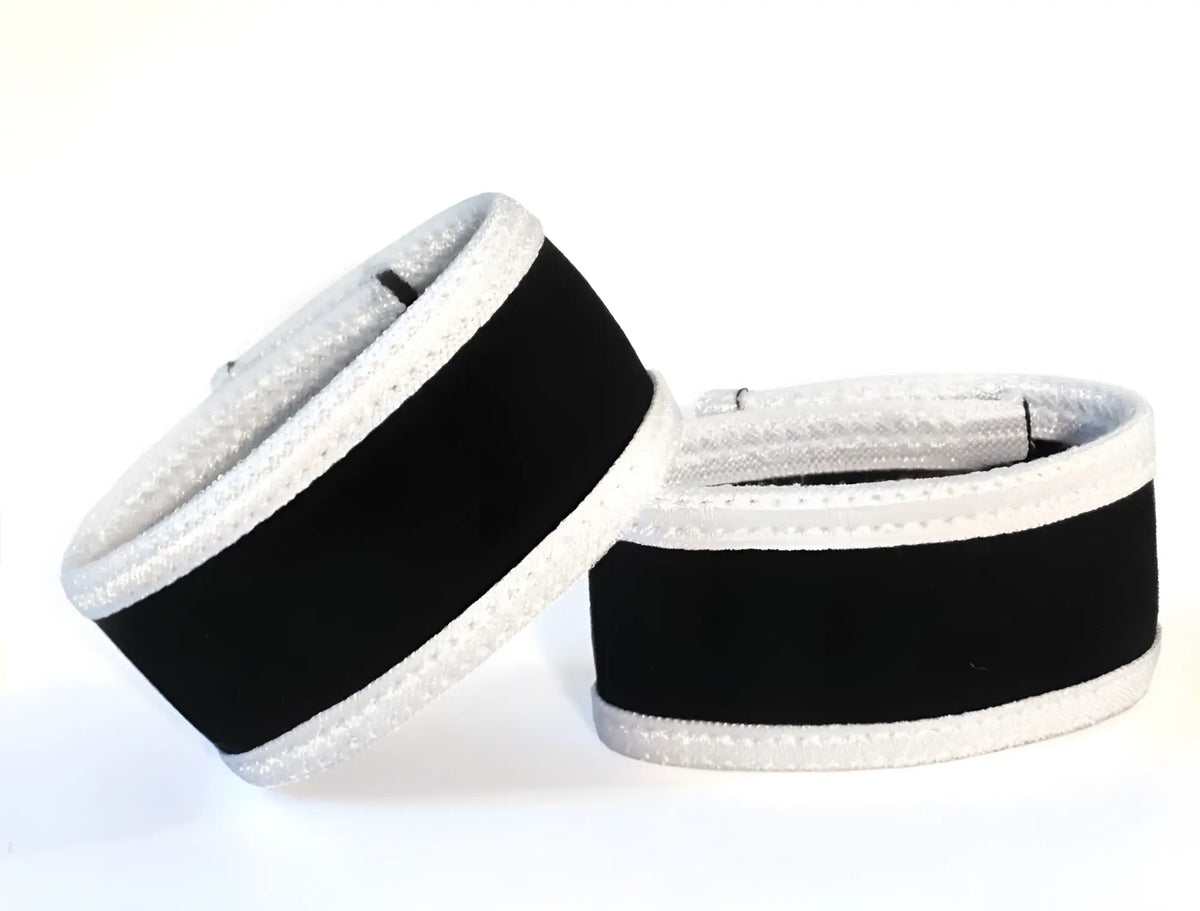 Wildmant max cock-rings in black with white trim featuring black and silver textured padded wrist wraps design