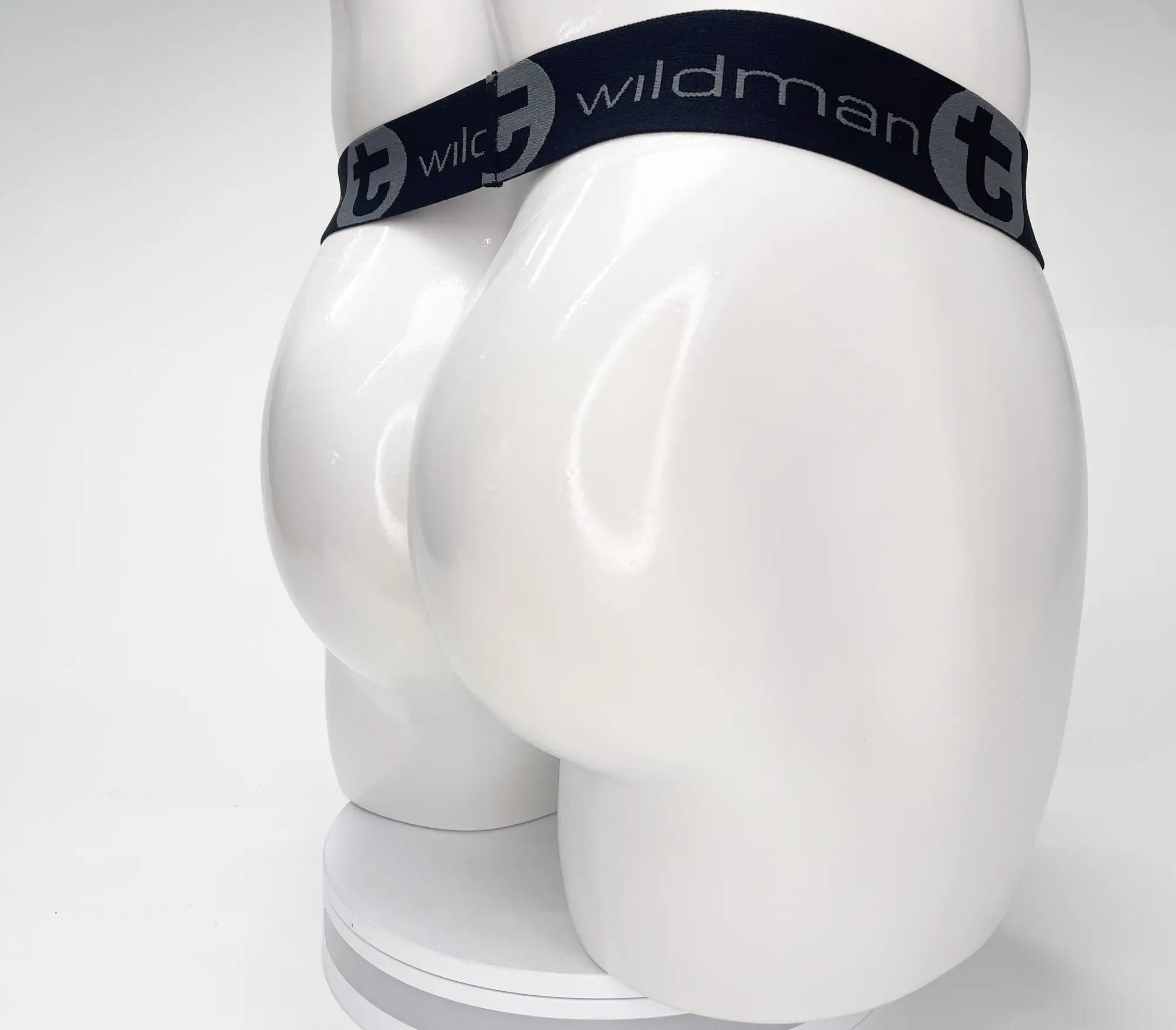 Black elastic waistband with wildman branding and logo on wildmant mesh monster cock strapless pouch black product