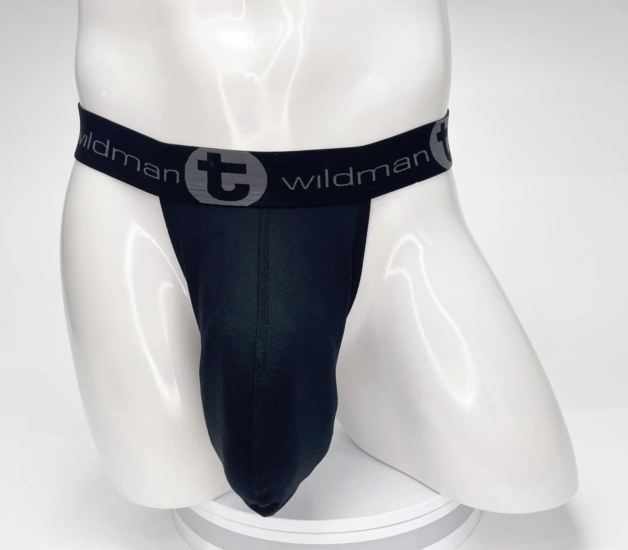 Black wildman brand jockstrap with gray logo band featuring wildmant mesh monster cock strapless pouch in black