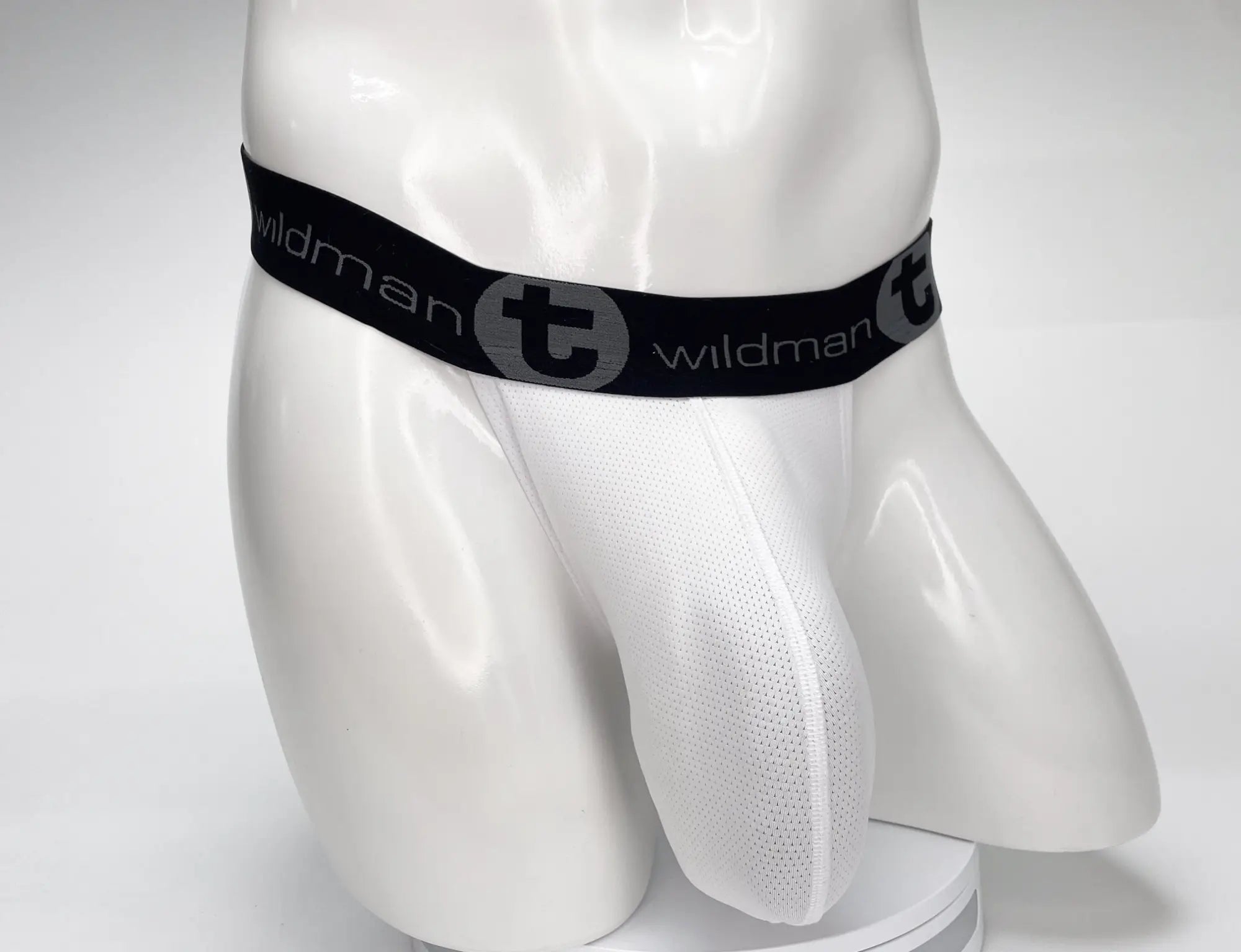 White mesh briefs with black elastic waistband featuring wildman t logo from wildmant mesh monster cock strapless pouch white
