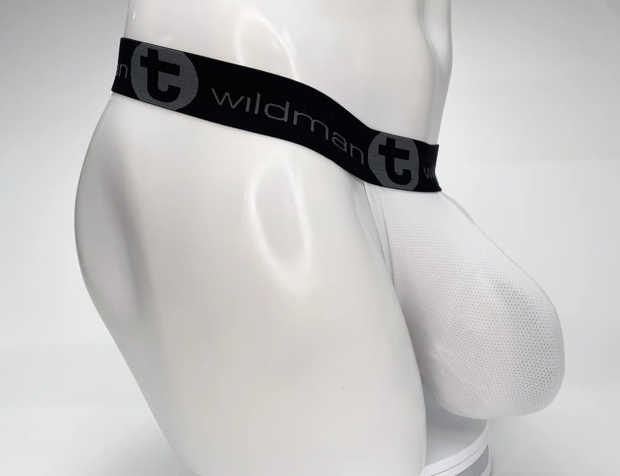 White mesh men’s briefs with black wildman elastic waistband and strapless pouch for comfort and support