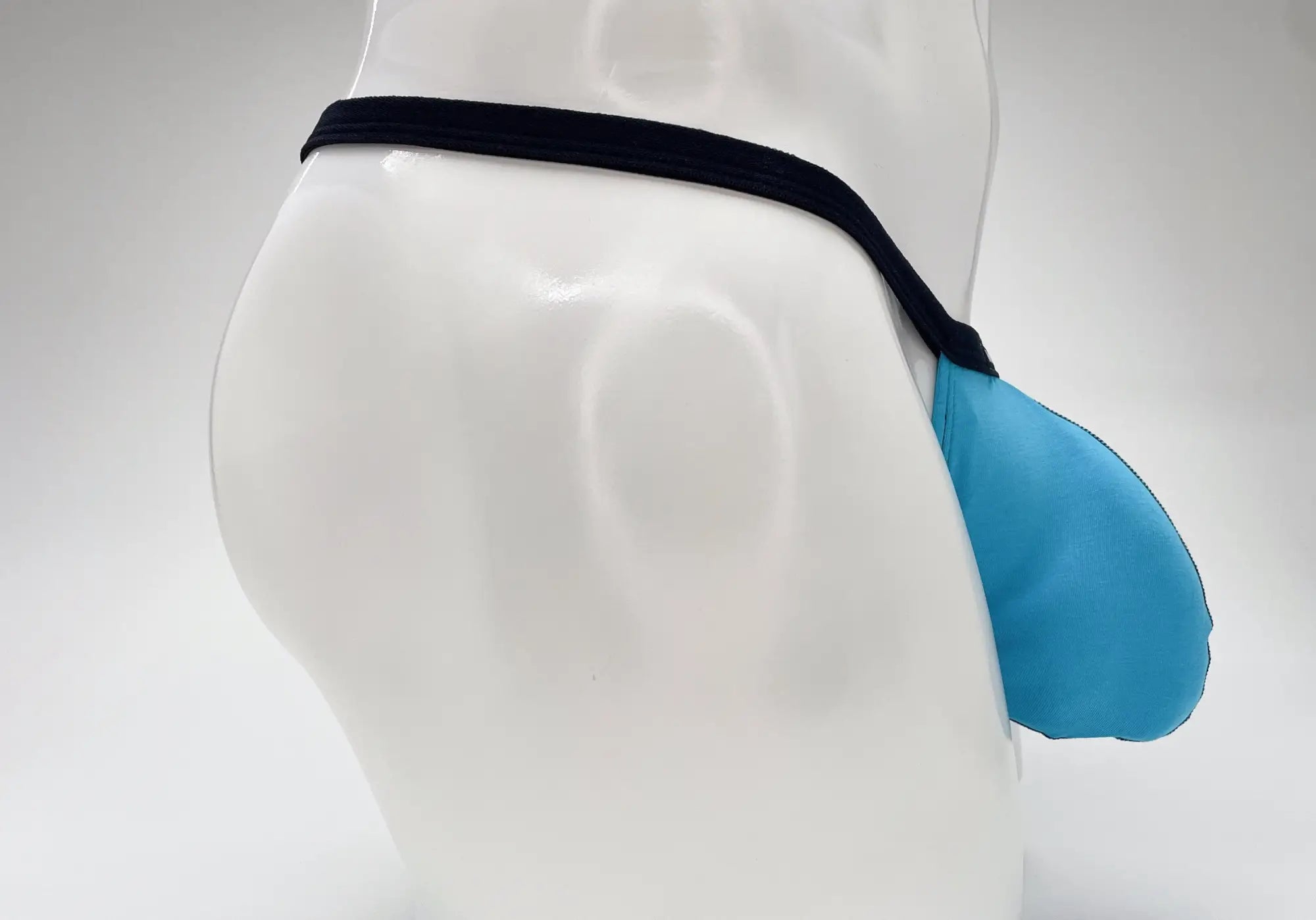 Blue wildmant modal micro thong with black elastic waistband featuring big boy pouch in baby blue color