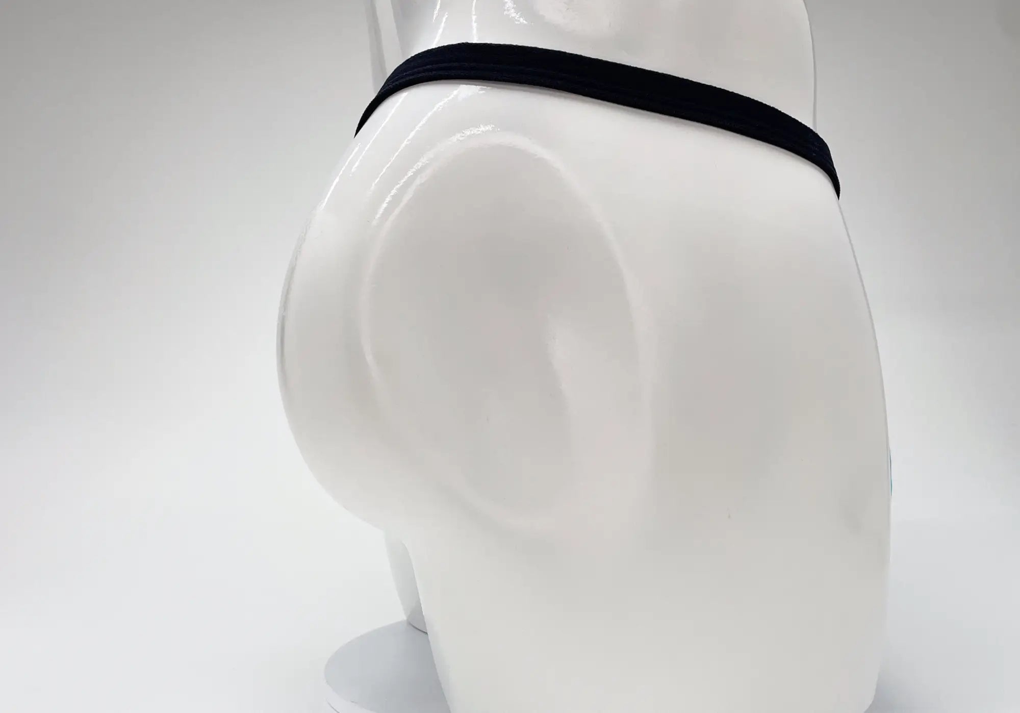 Wildmant modal micro thong with black elastic waistband displayed on white mannequin in baby blue color