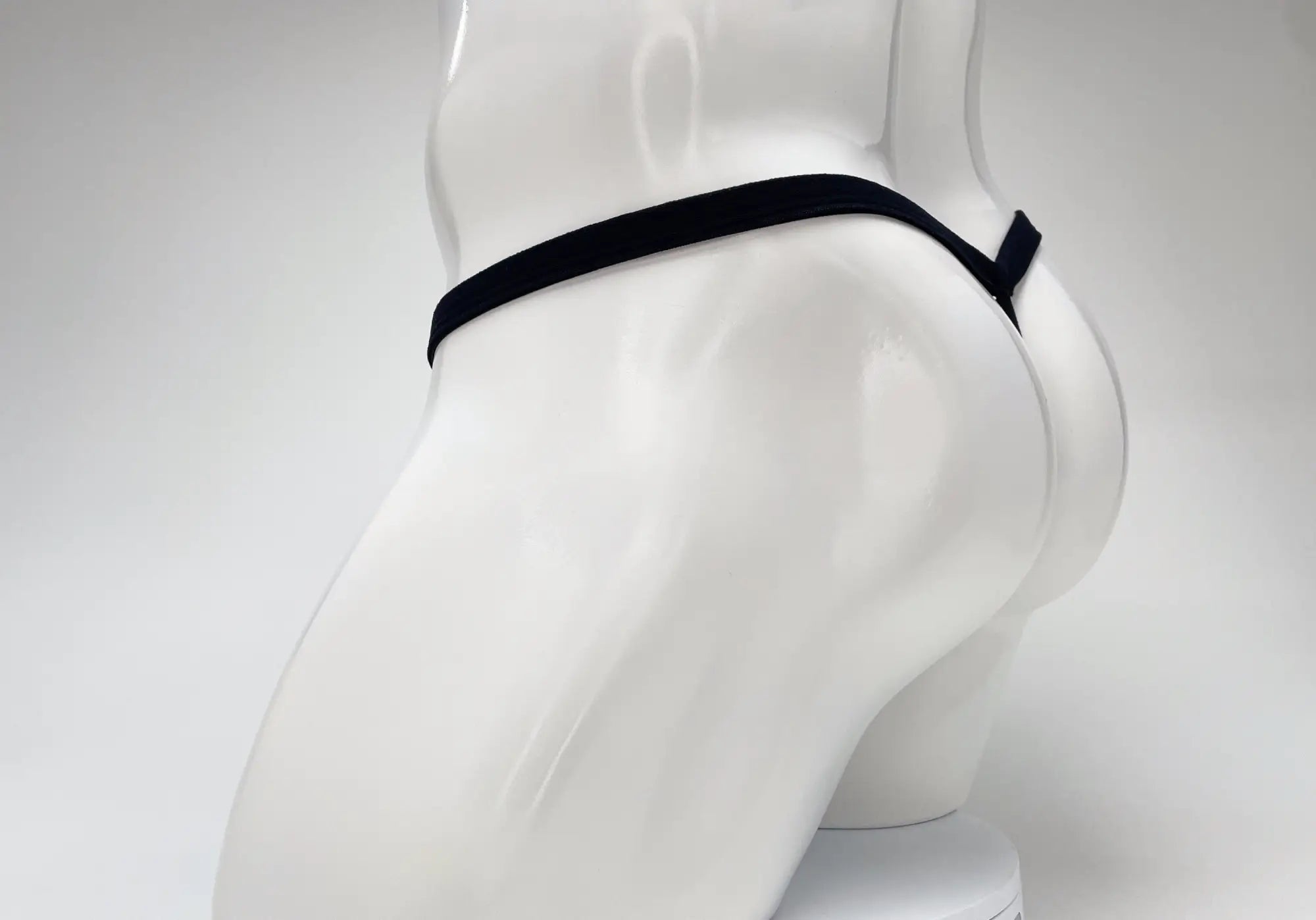 Black elastic waistband with a small tab on the side of wildmant modal micro thong big boy pouch in baby blue