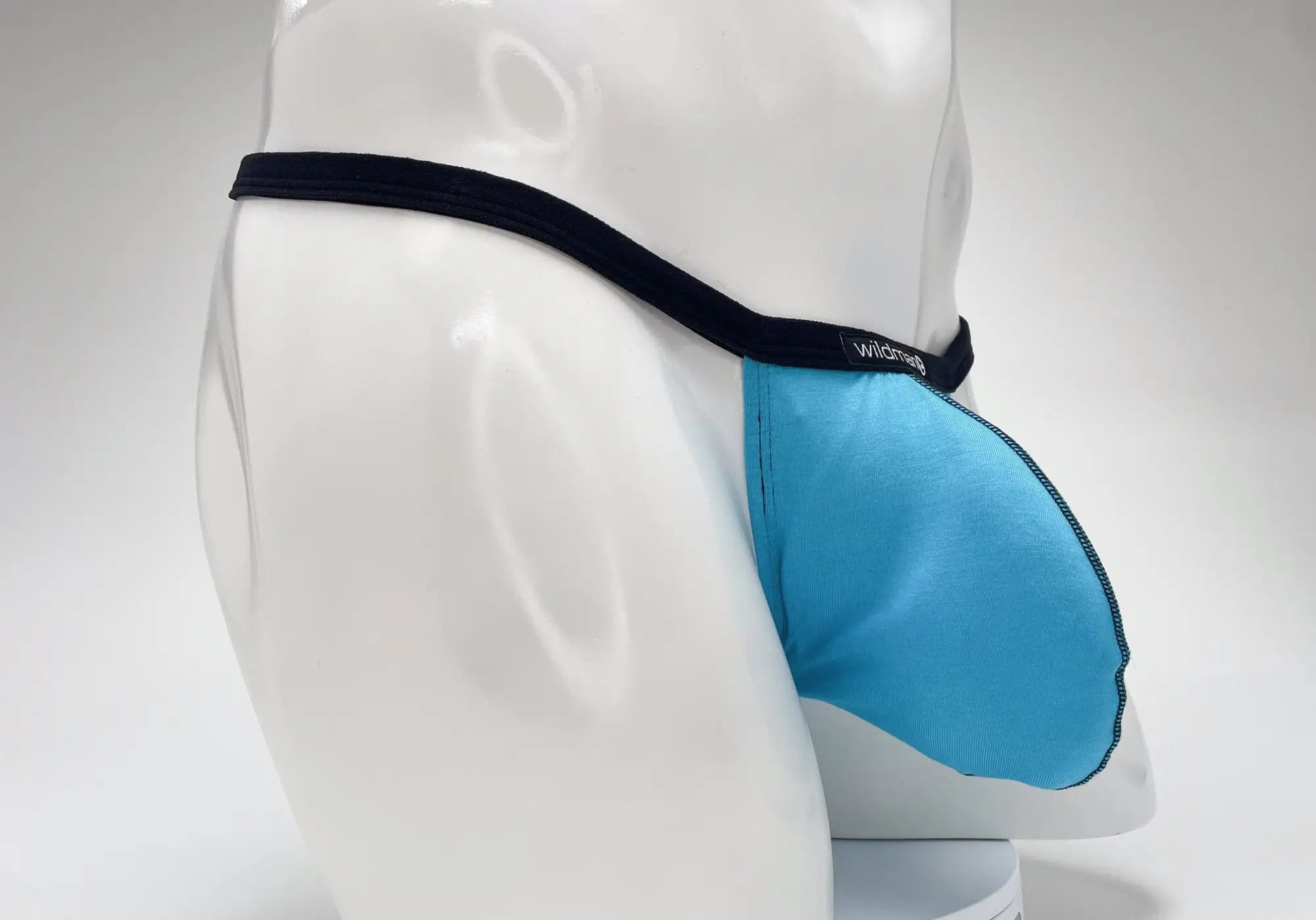 Wildmant modal micro thong big boy pouch in baby blue with black waistband and wildness brand label