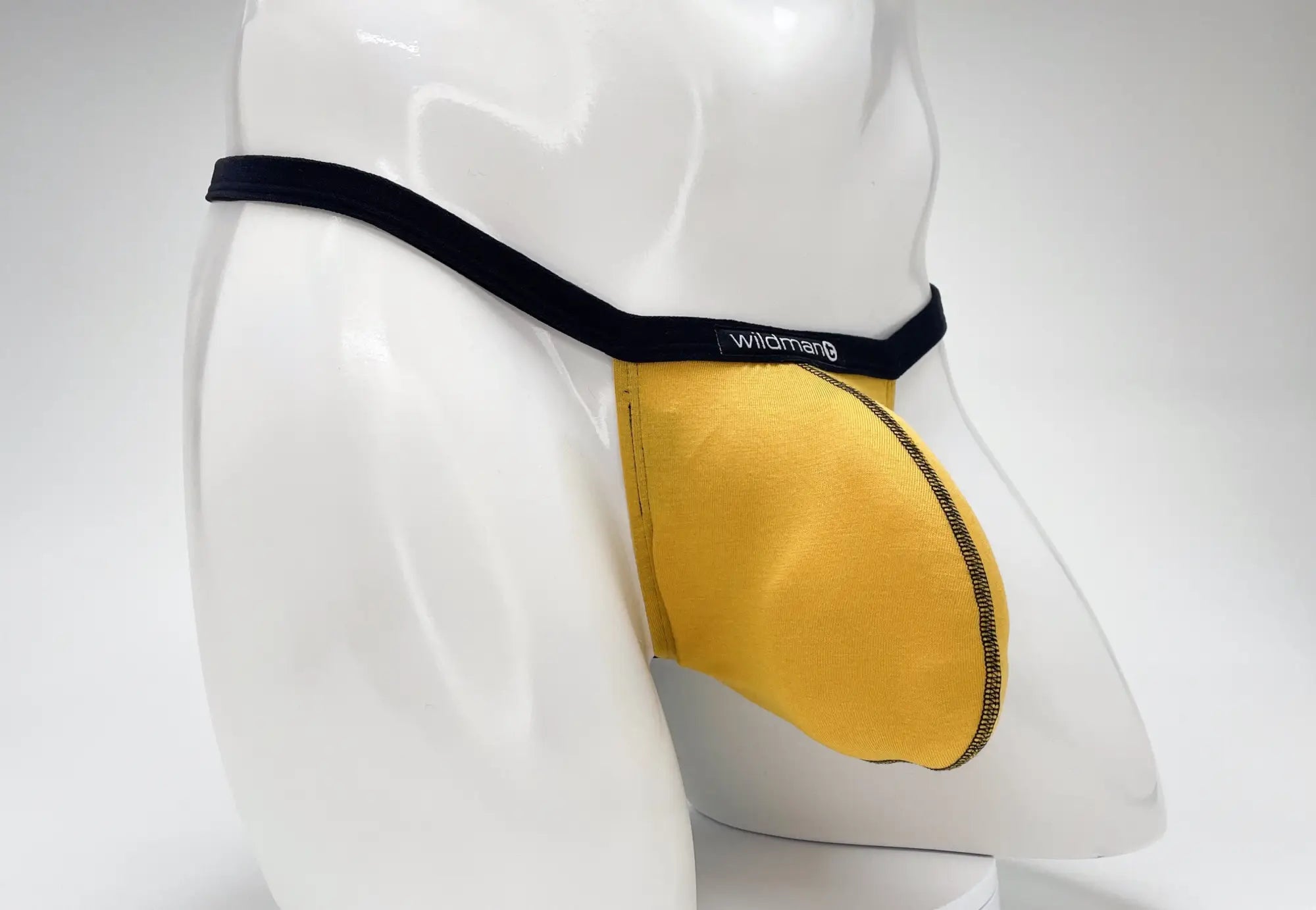 Yellow wildman modal micro thong men’s briefs with black waistband and big boy pouch gold color