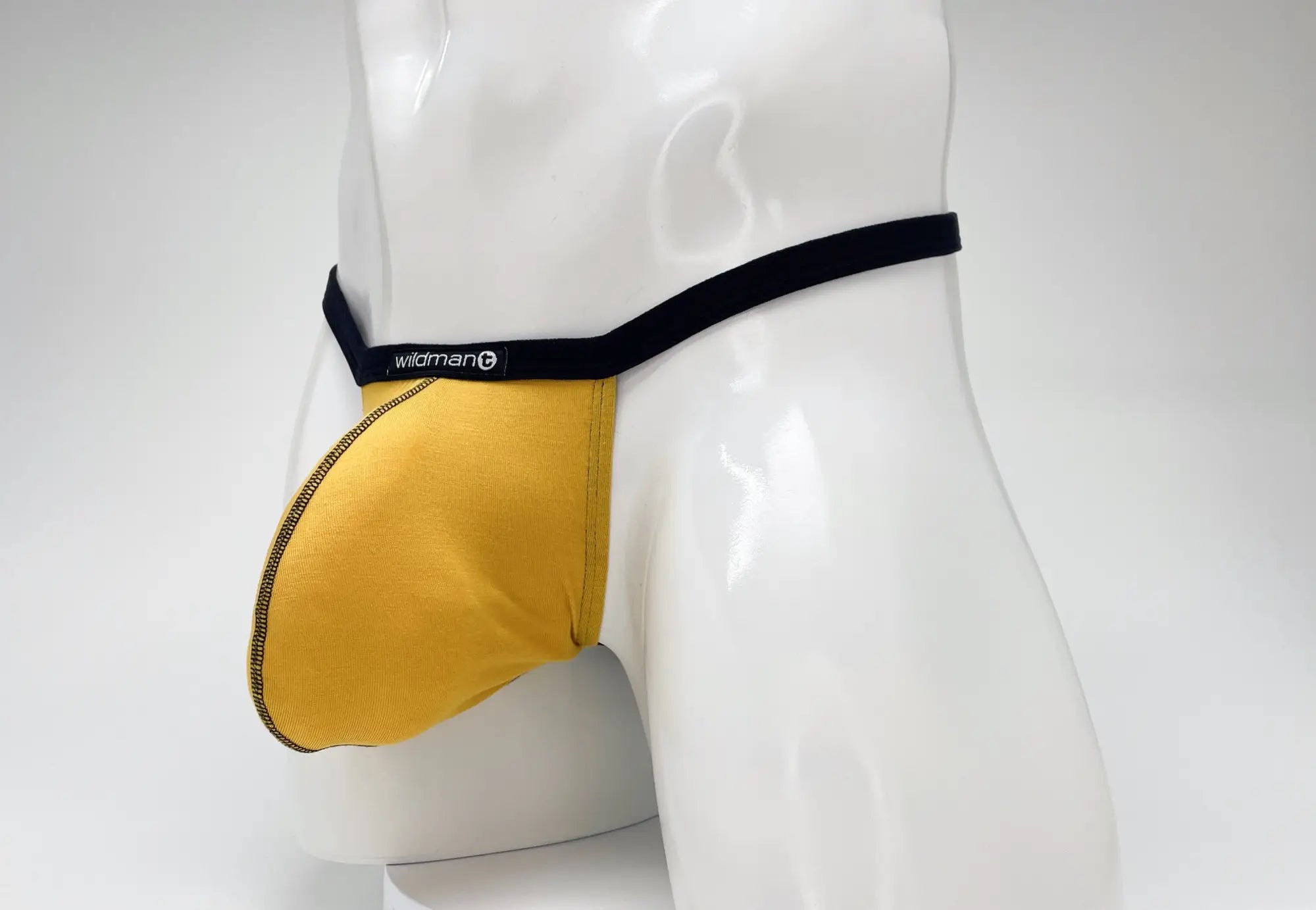 Yellow wildman mens modal micro thong briefs with black waistband zipper detail and big boy pouch gold color