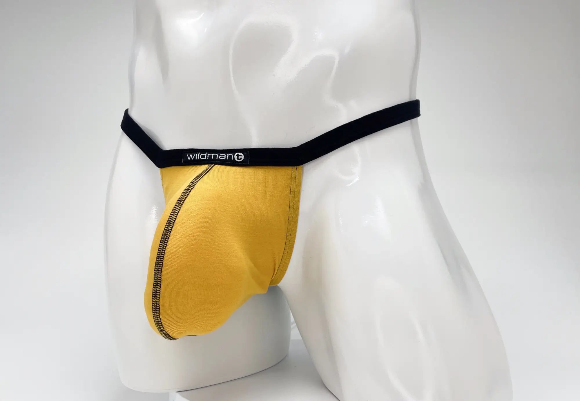 Yellow wildman brand men’s modal micro thong briefs with black waistband and gold trim in big boy pouch design