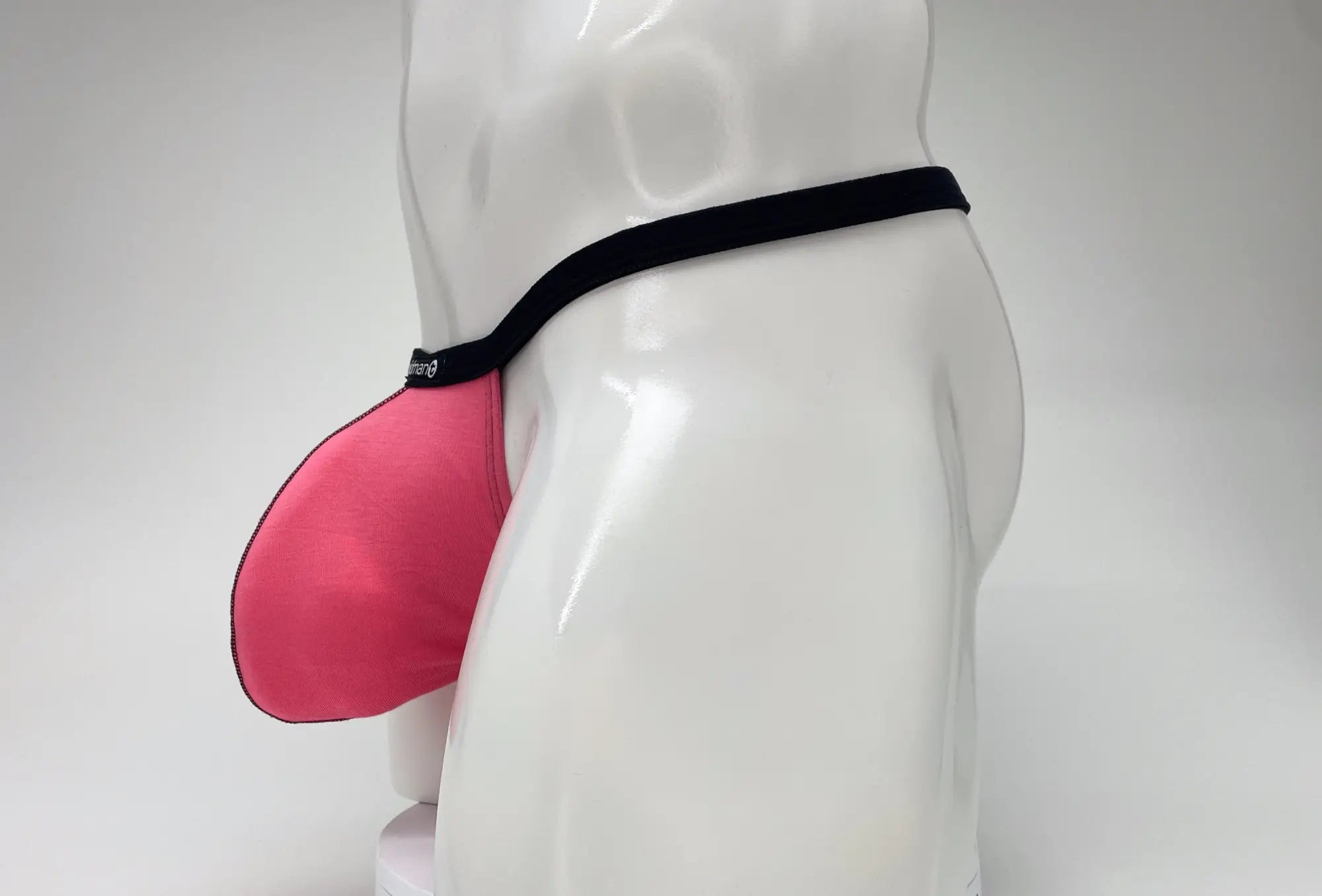 Wildmant modal micro thong big boy pouch in pink fabric with black elastic band for comfortable support