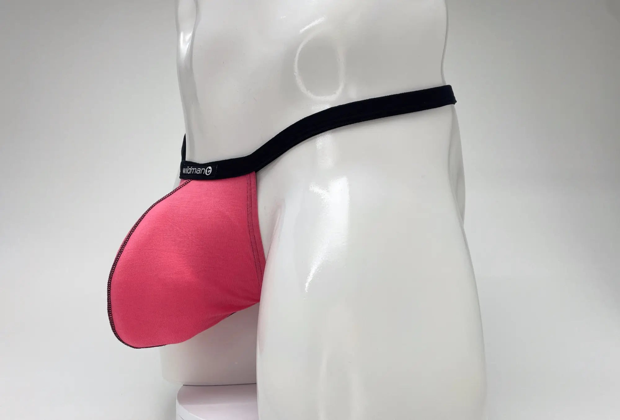 Pink men’s support briefs with black elastic waistband and wideman logo made of modal fabric for big boy pouch comfort