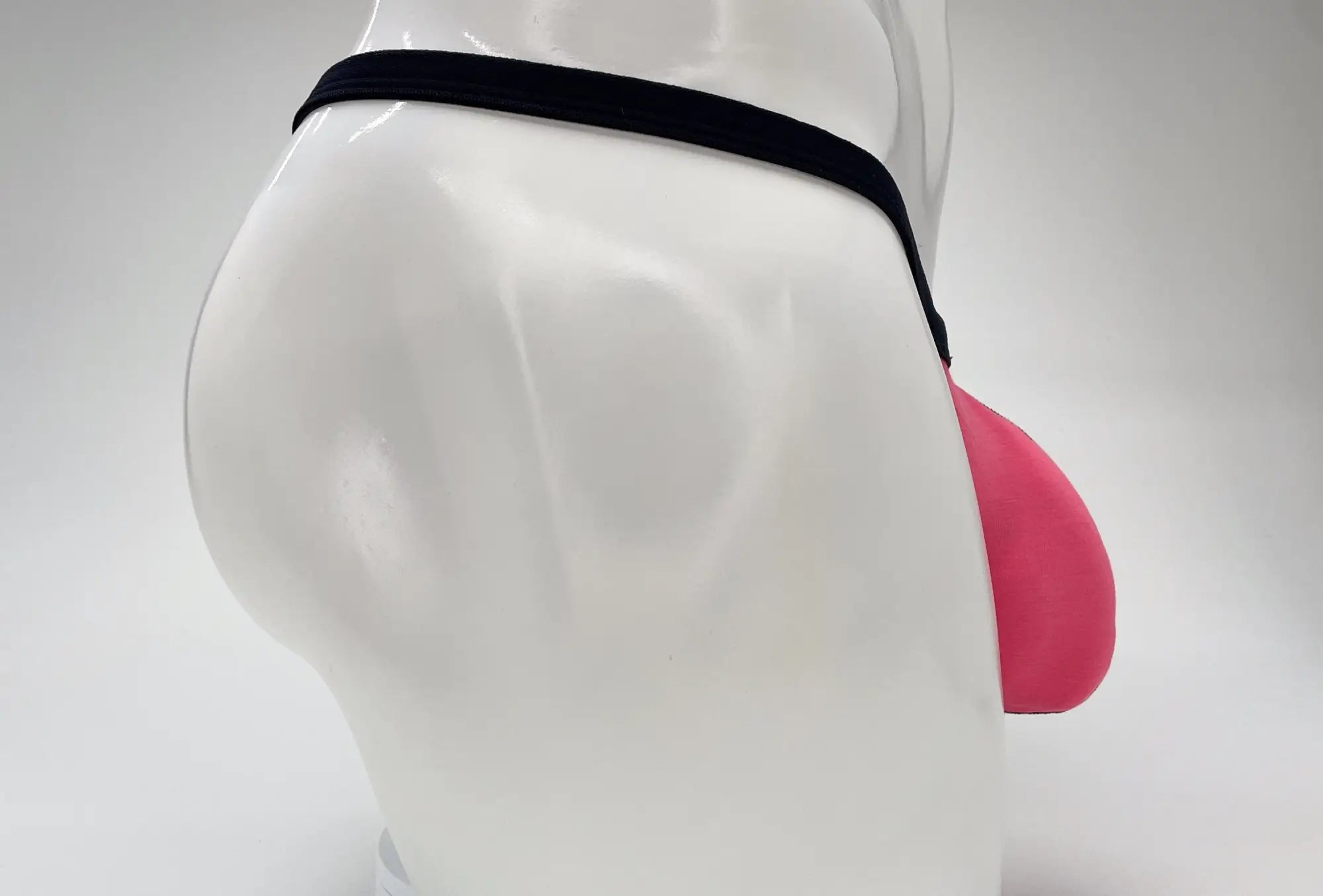 Pink silicone jockstrap with black elastic waistband from wildmant modal micro thong big boy pouch collection