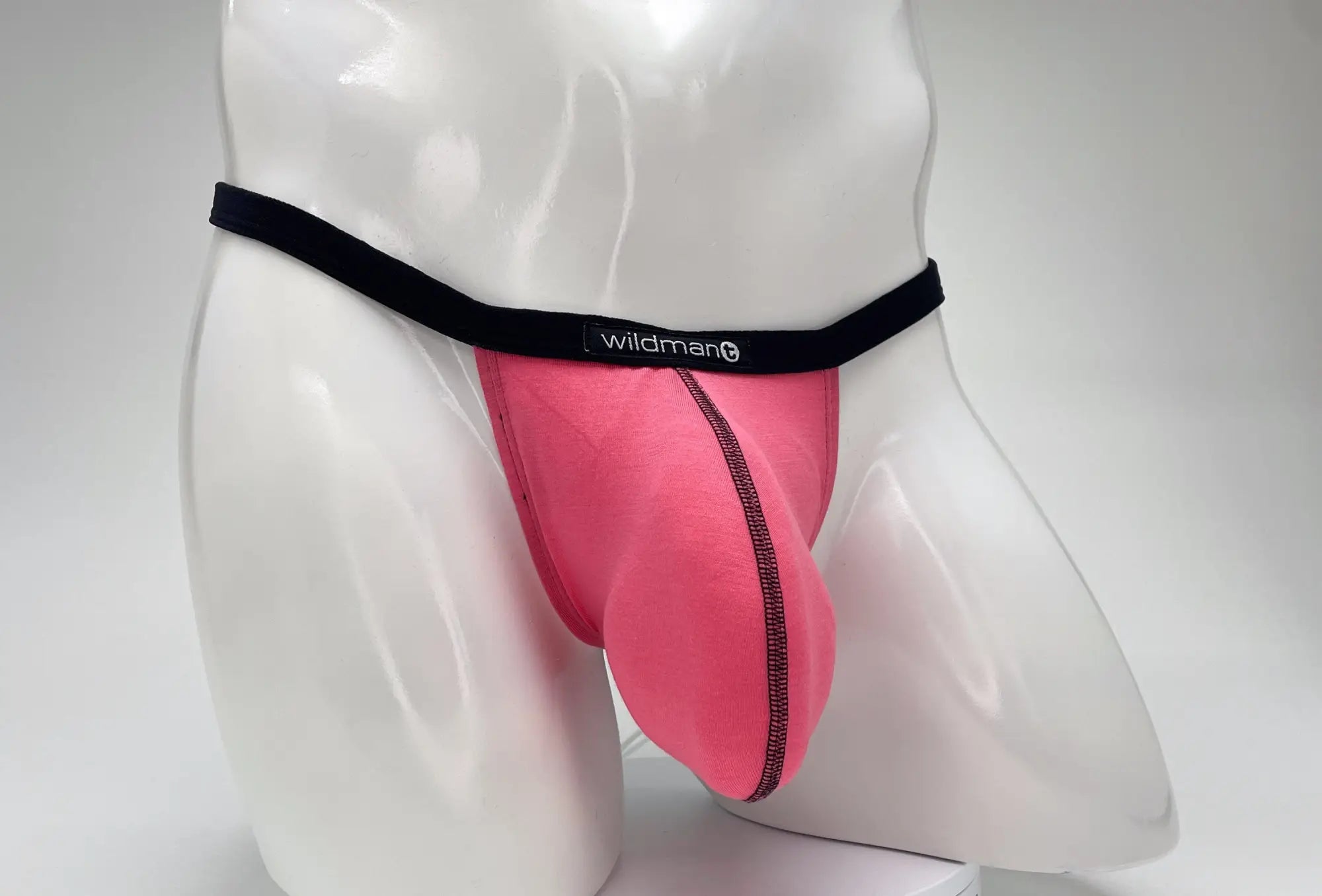 Pink wildman mens modal micro thong briefs with black waistband and zipper detail wildmanT big boy pouch